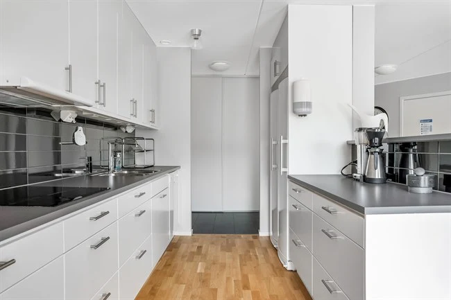 A kitchen with a stove and a sink