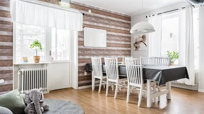 A living room filled with furniture on top of a hard wood floor