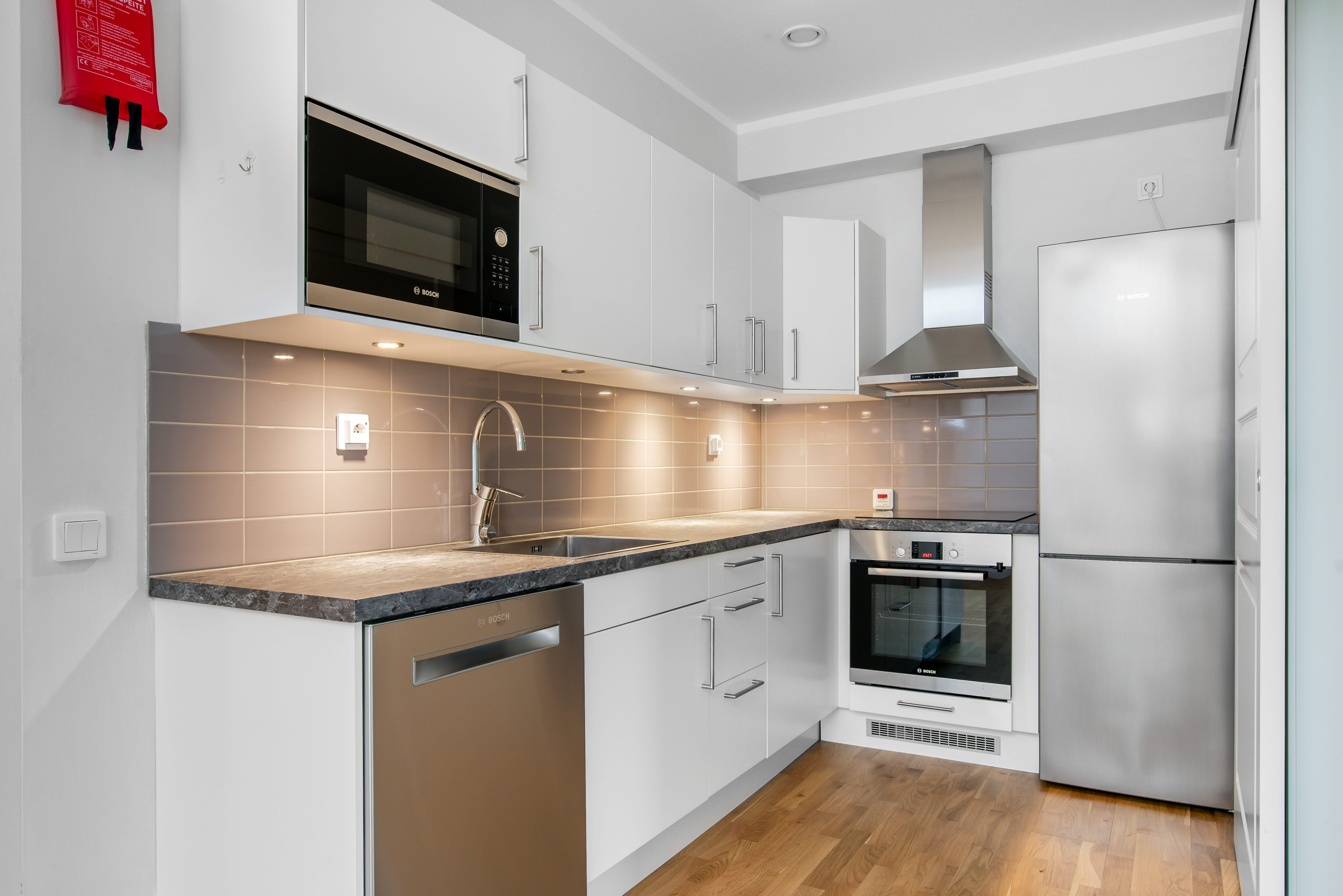 A kitchen with a stove and a microwave