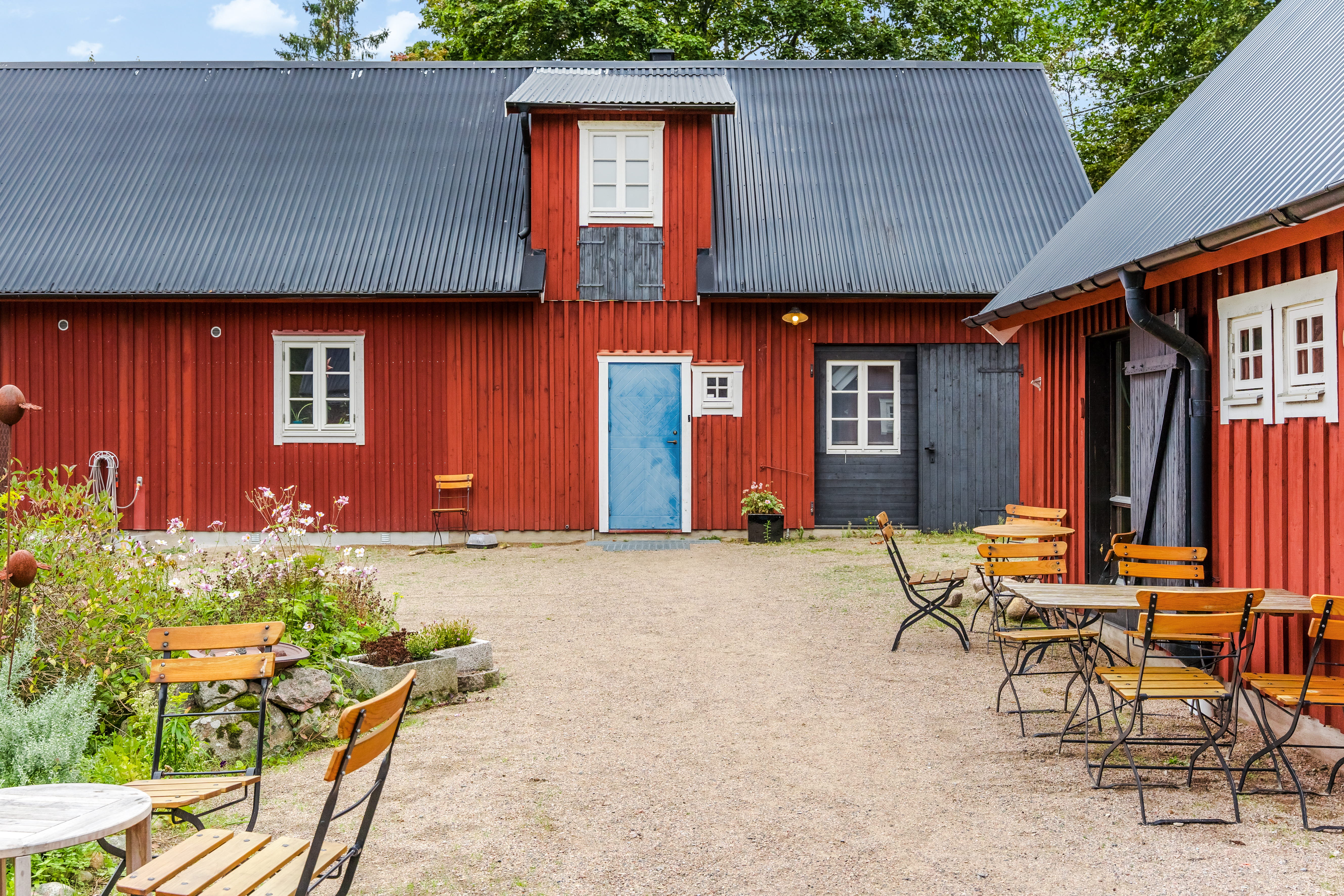 A wooden bench in front of a house
