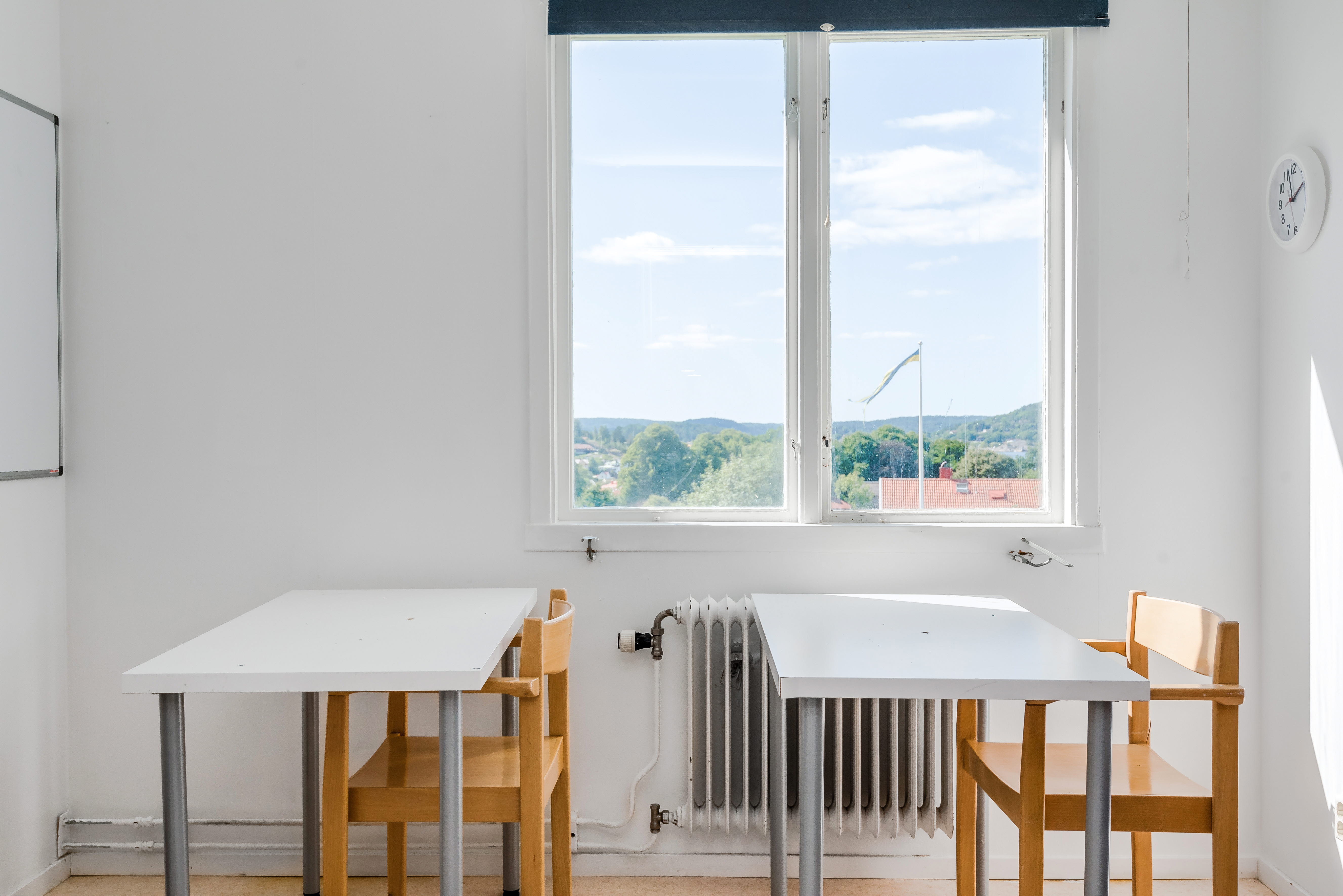 A dining room table in front of a window