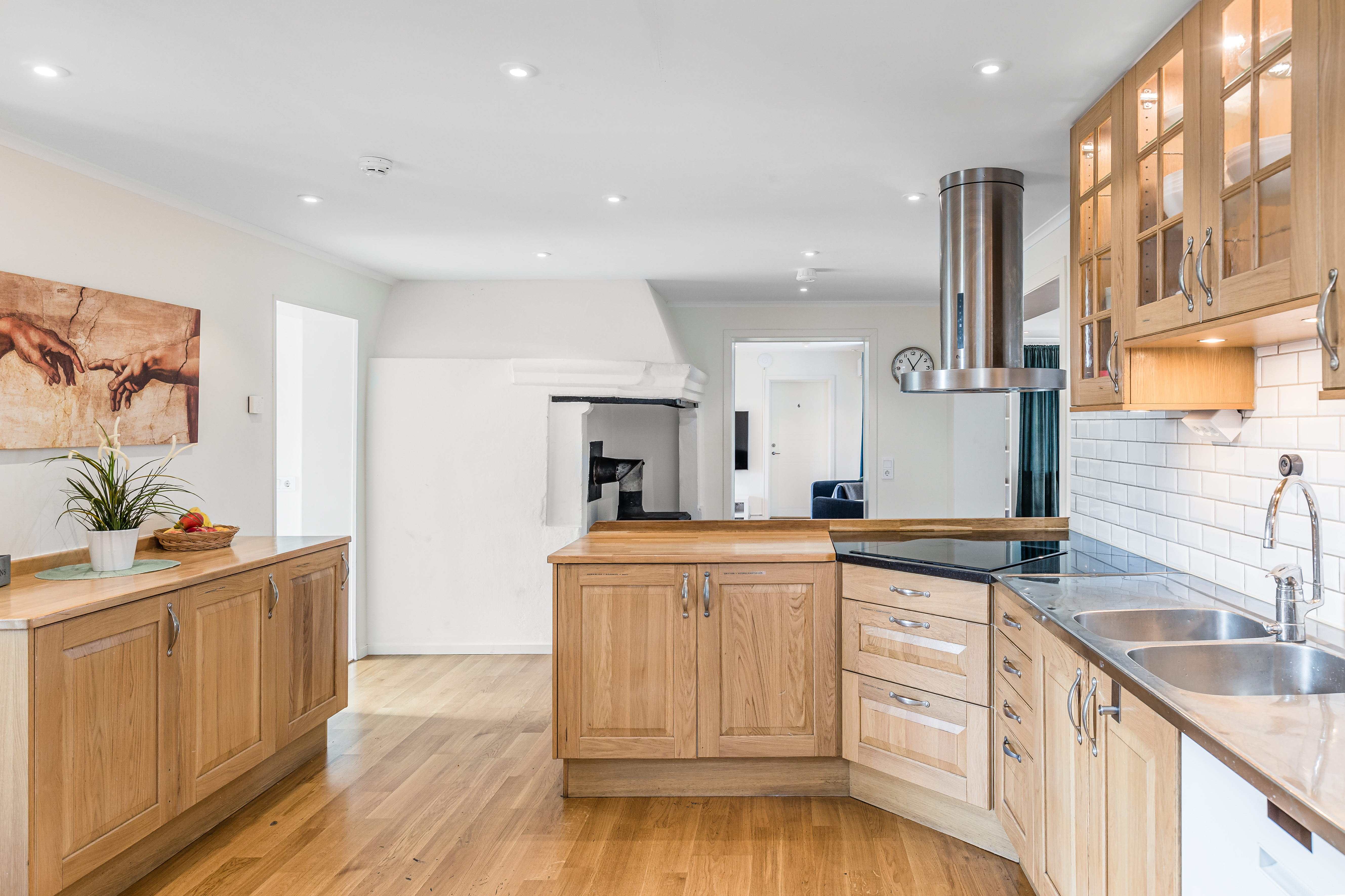 A kitchen with a wood floor