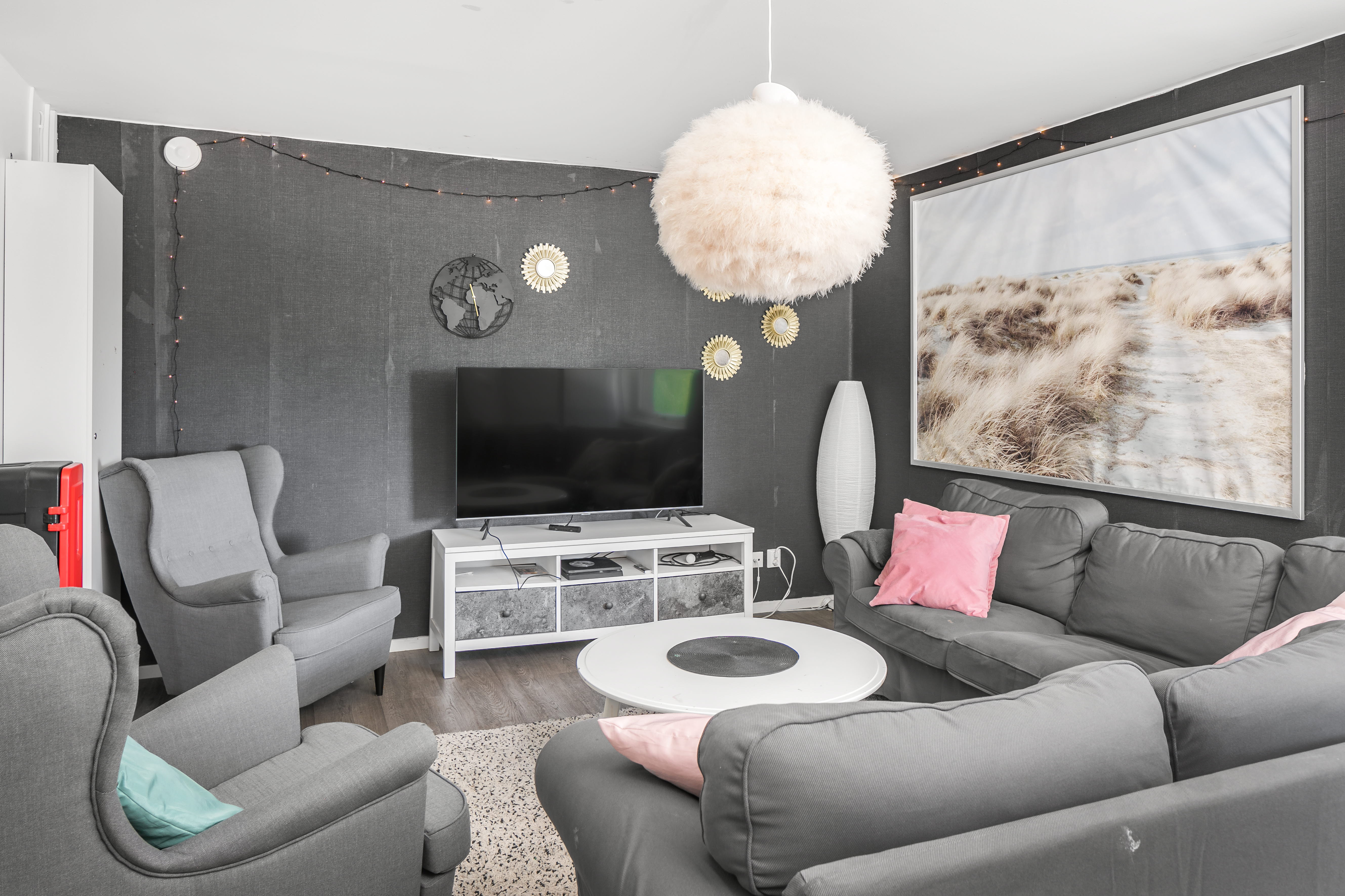 A living room filled with furniture and a large window