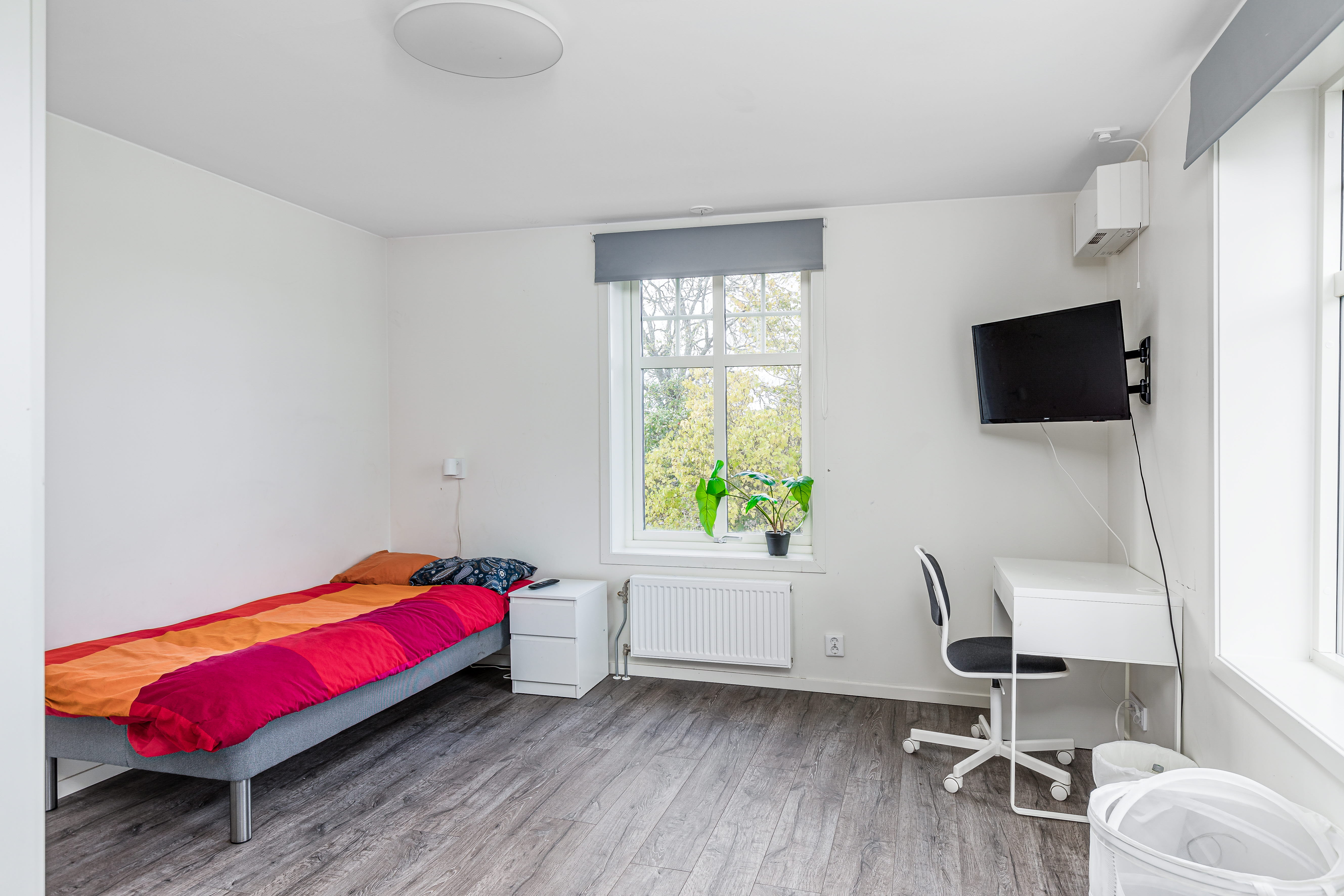 A bedroom with a large window