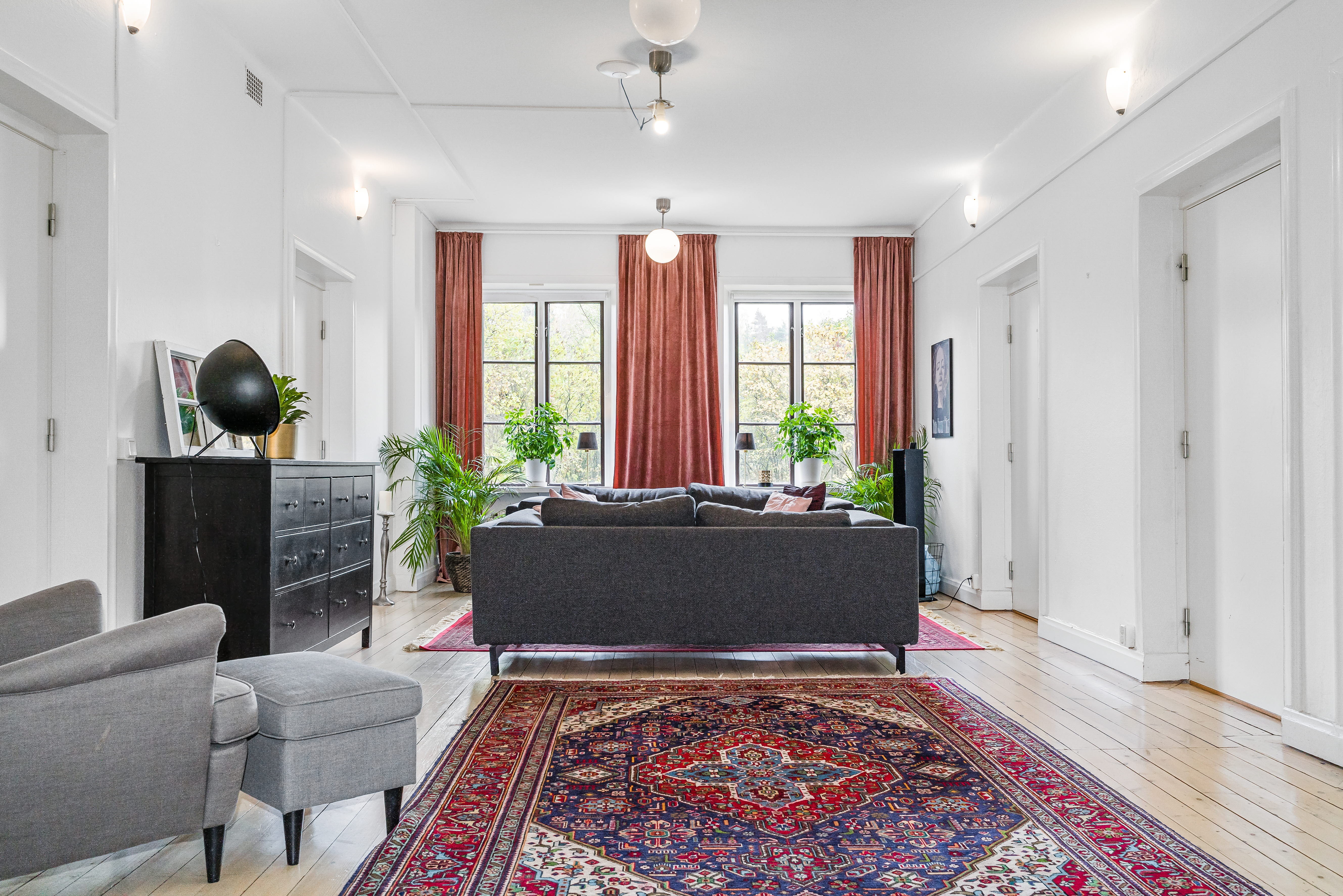 A living room filled with furniture and a large window