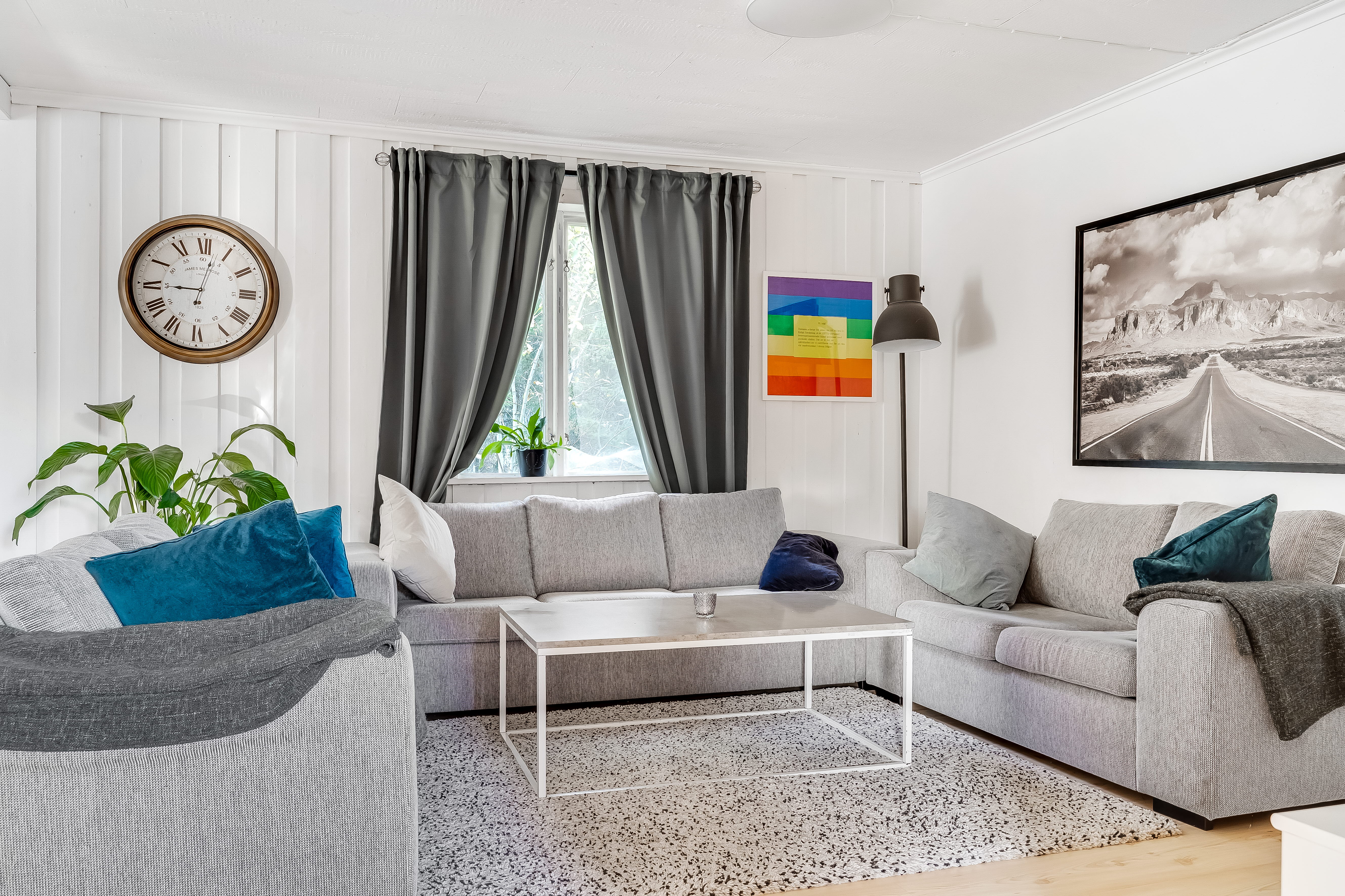 A living room filled with furniture and a flat screen tv