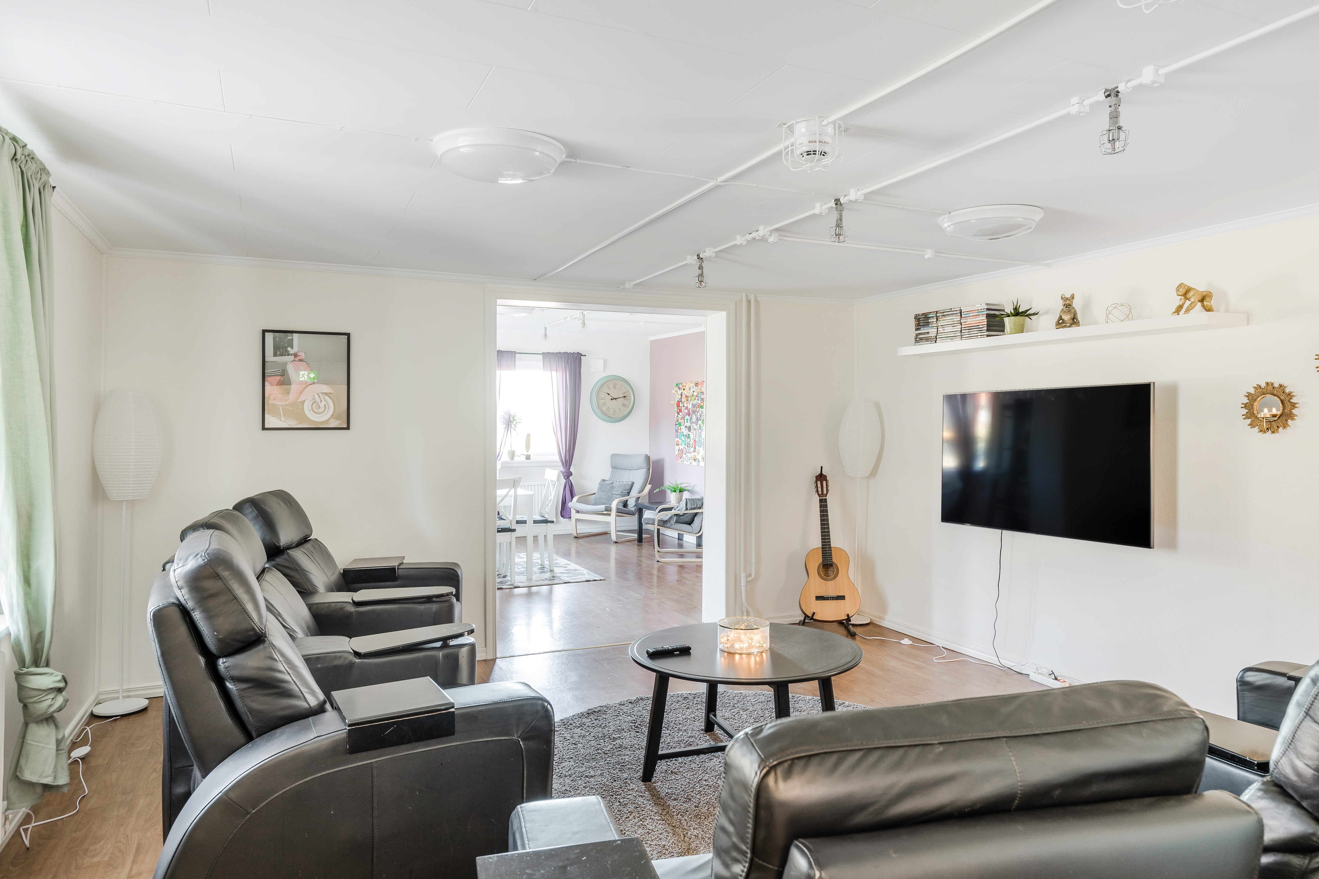 A living room filled with furniture and a large window
