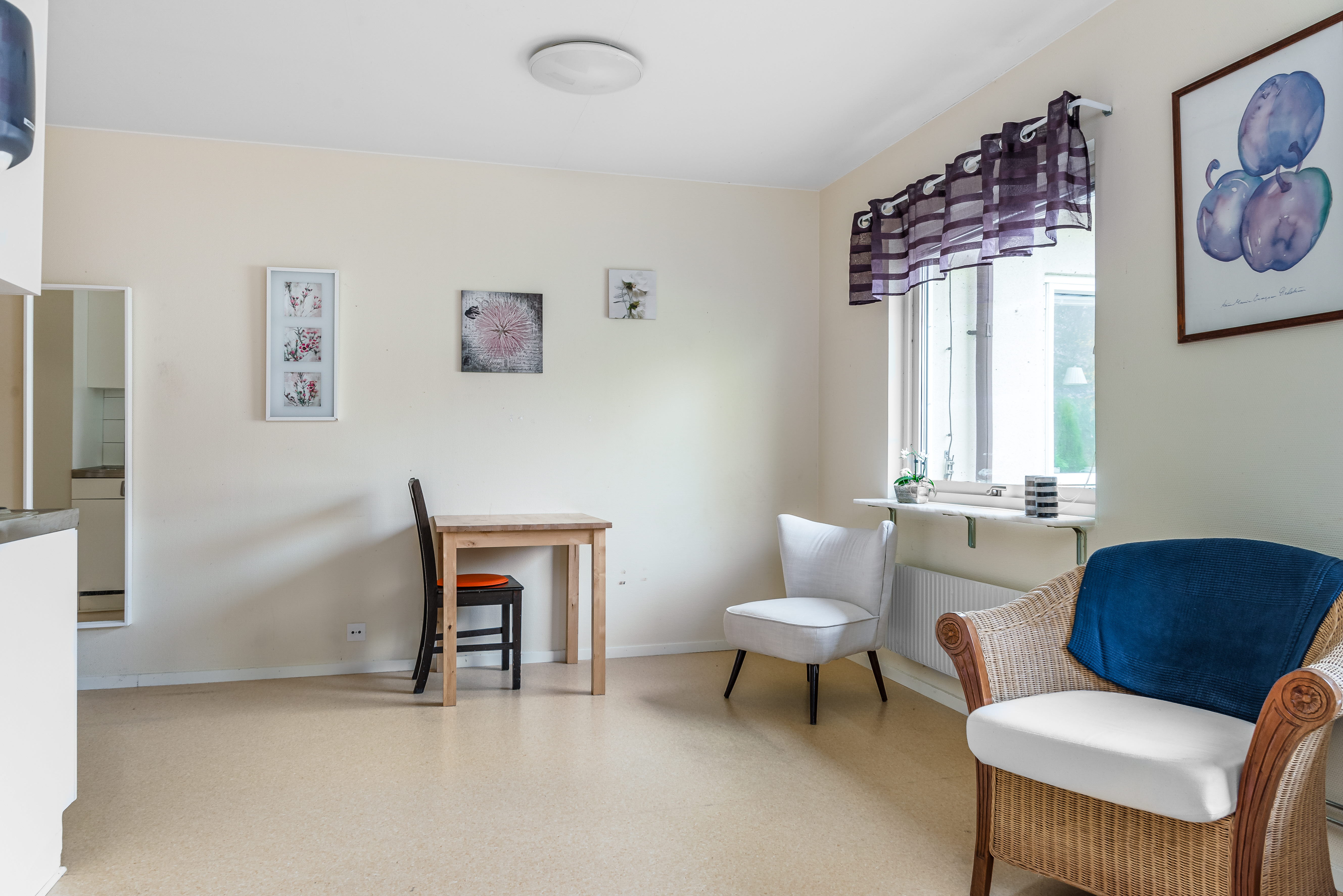 A living room filled with furniture and a large window