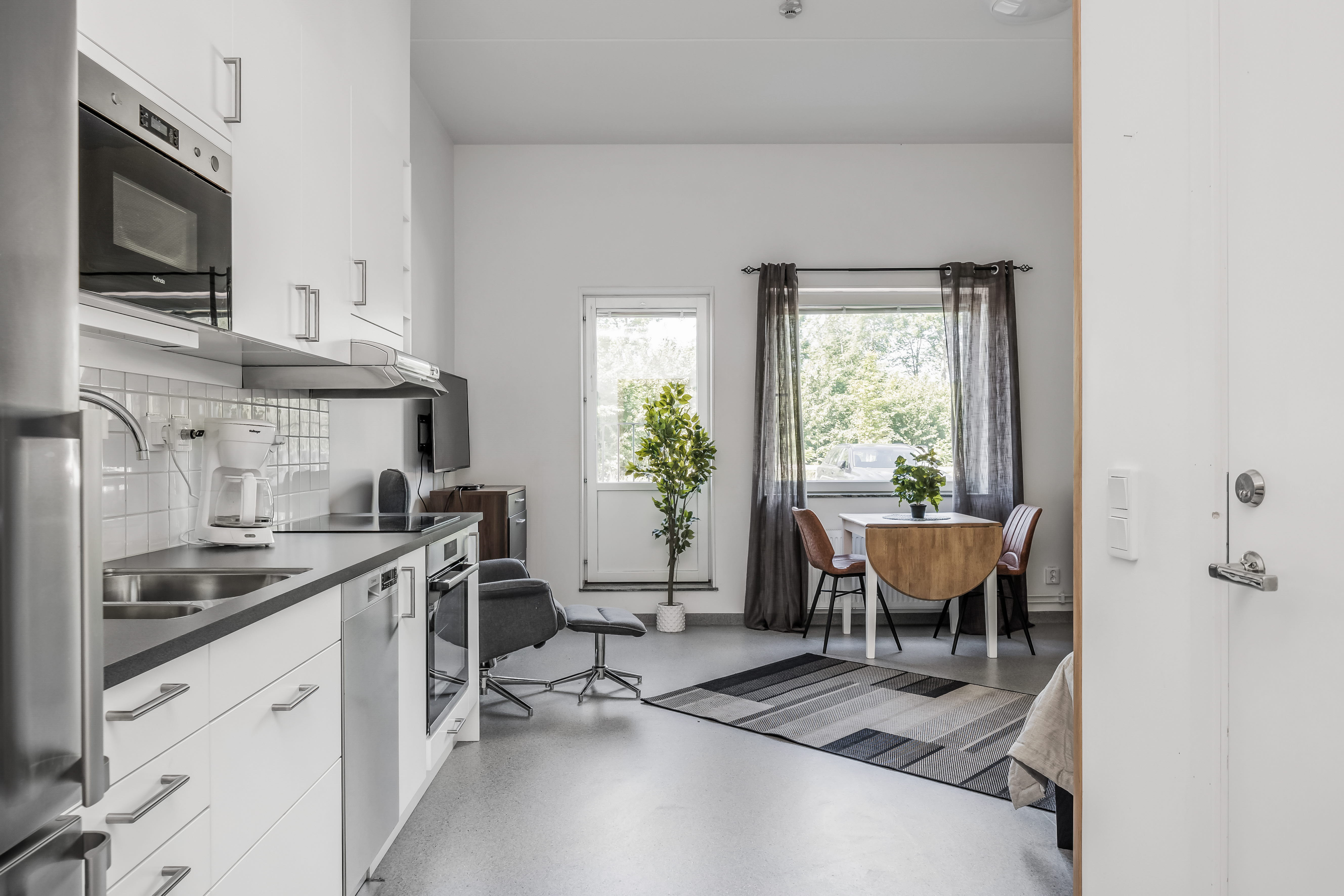 A kitchen with a dining room table