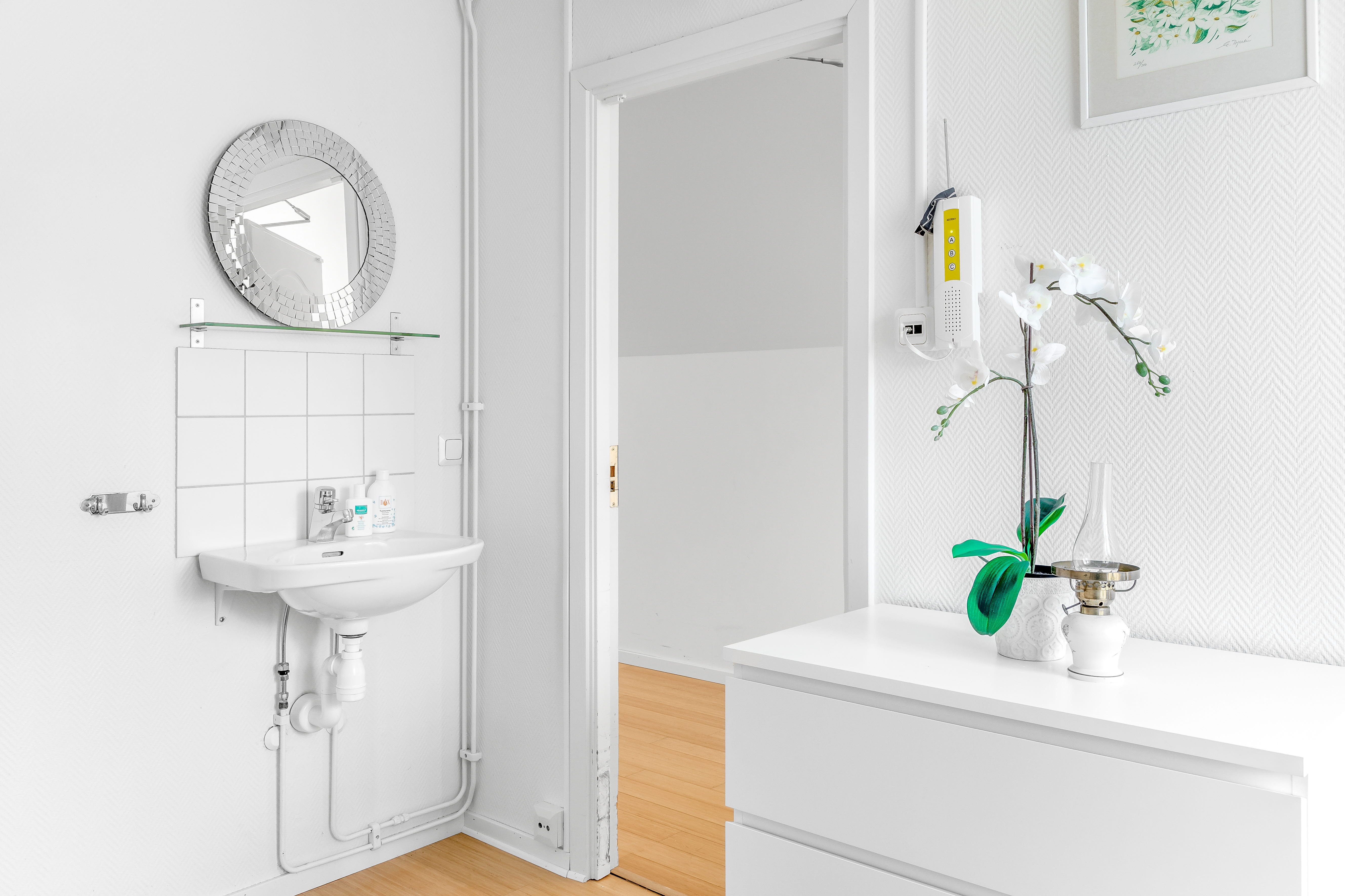A kitchen with a sink and a shower