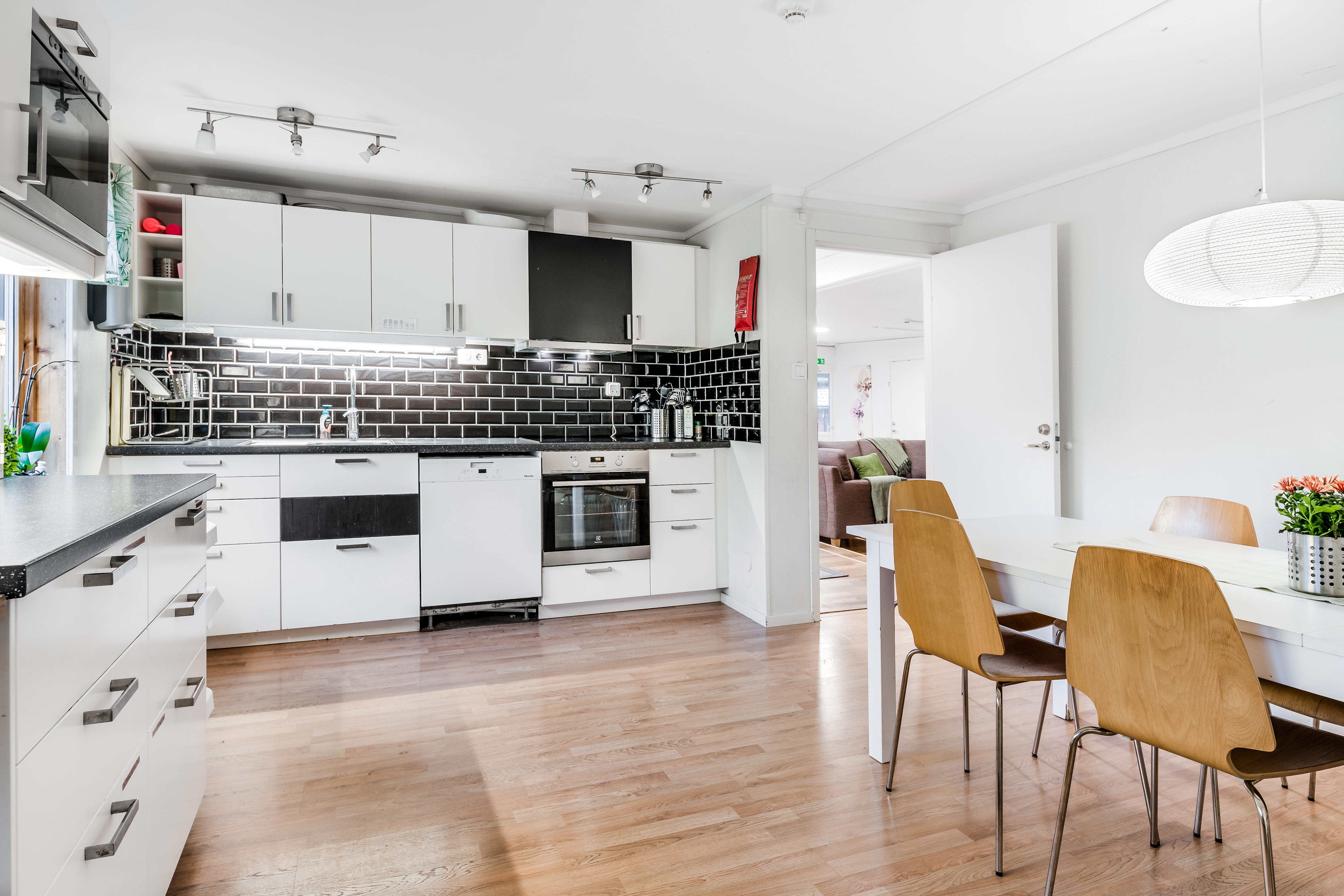 A kitchen with a wood floor
