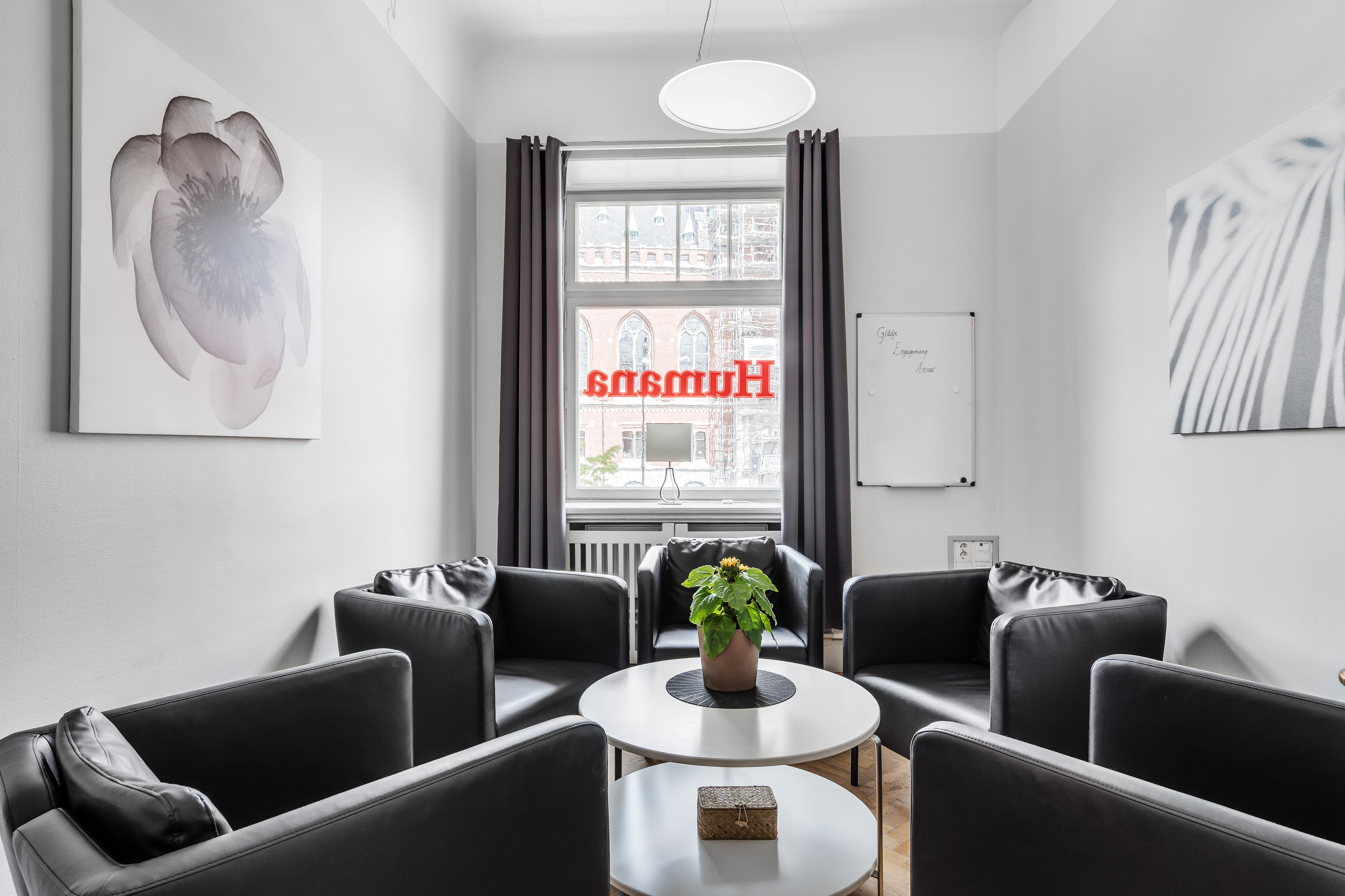 A living room filled with furniture and a large window
