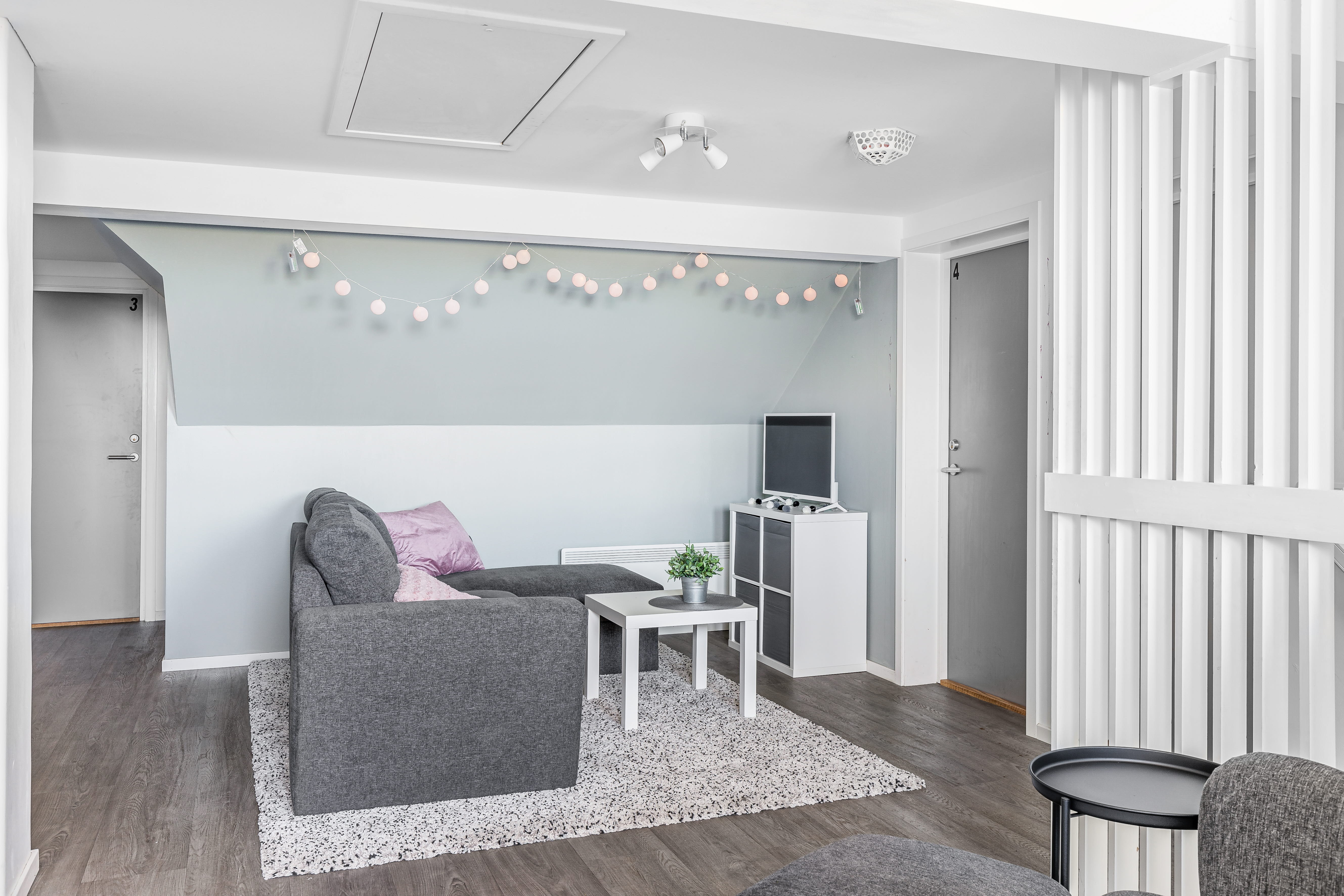 A room filled with furniture and a large window