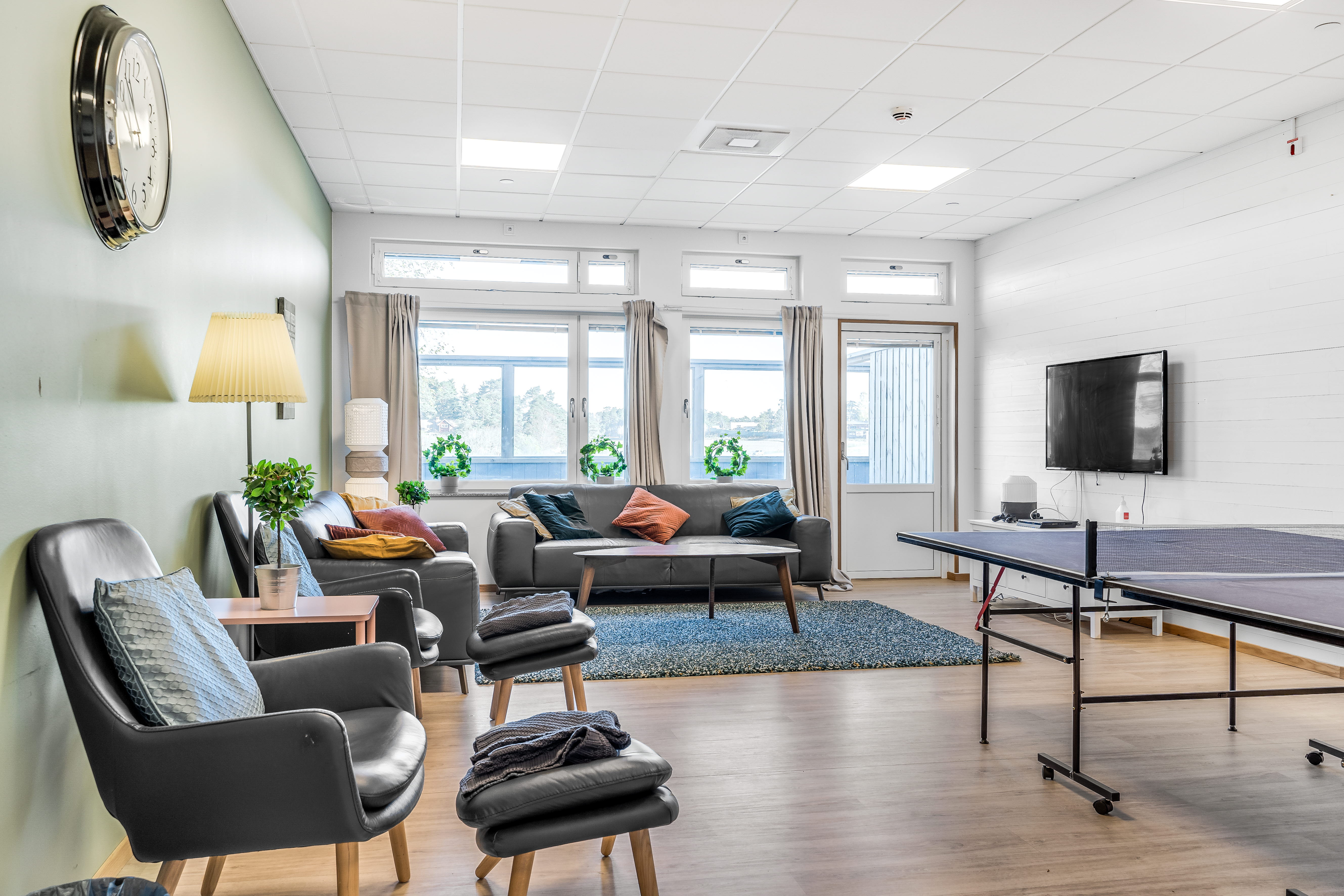 A living room filled with furniture and a large window