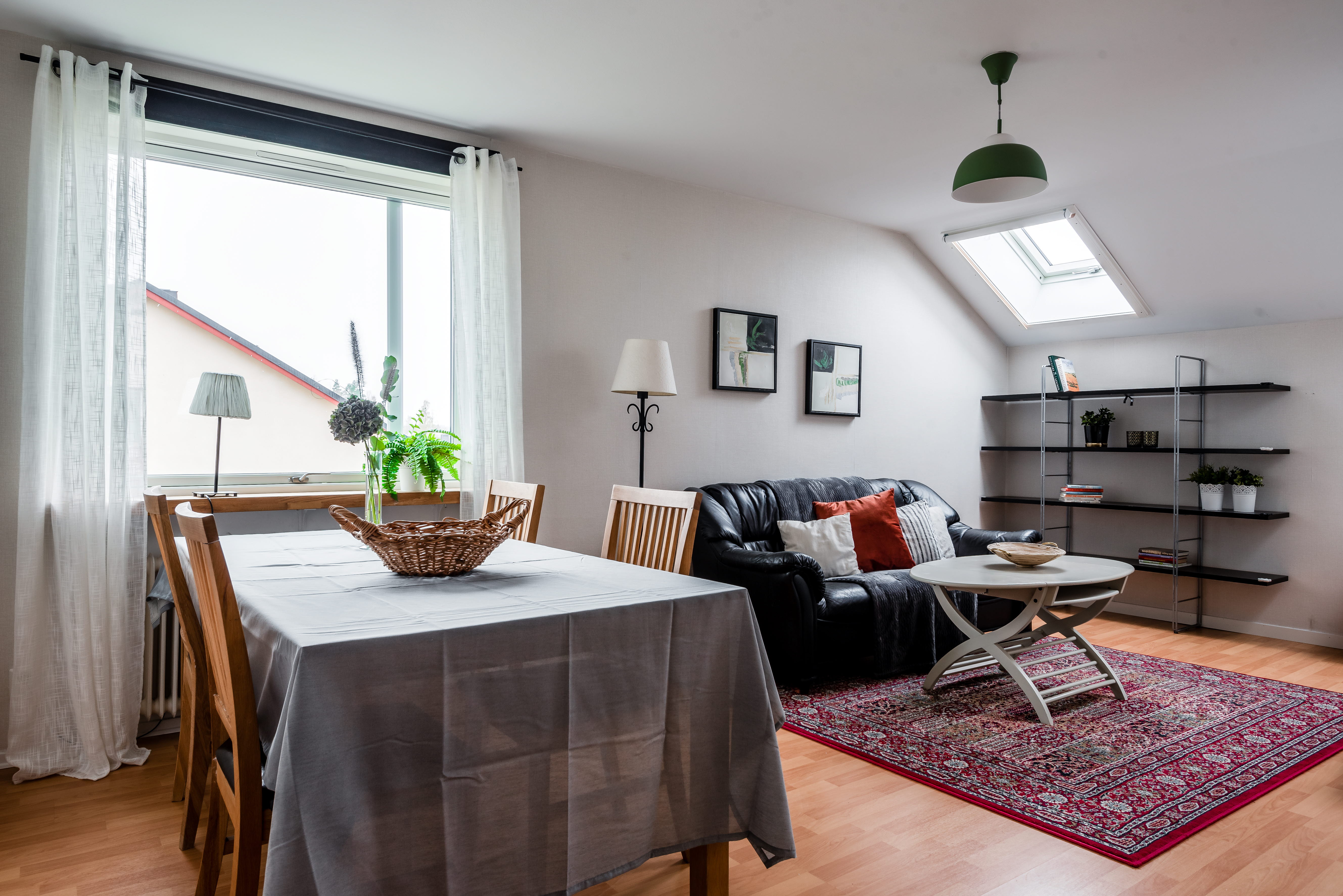 A dining room table in front of a window
