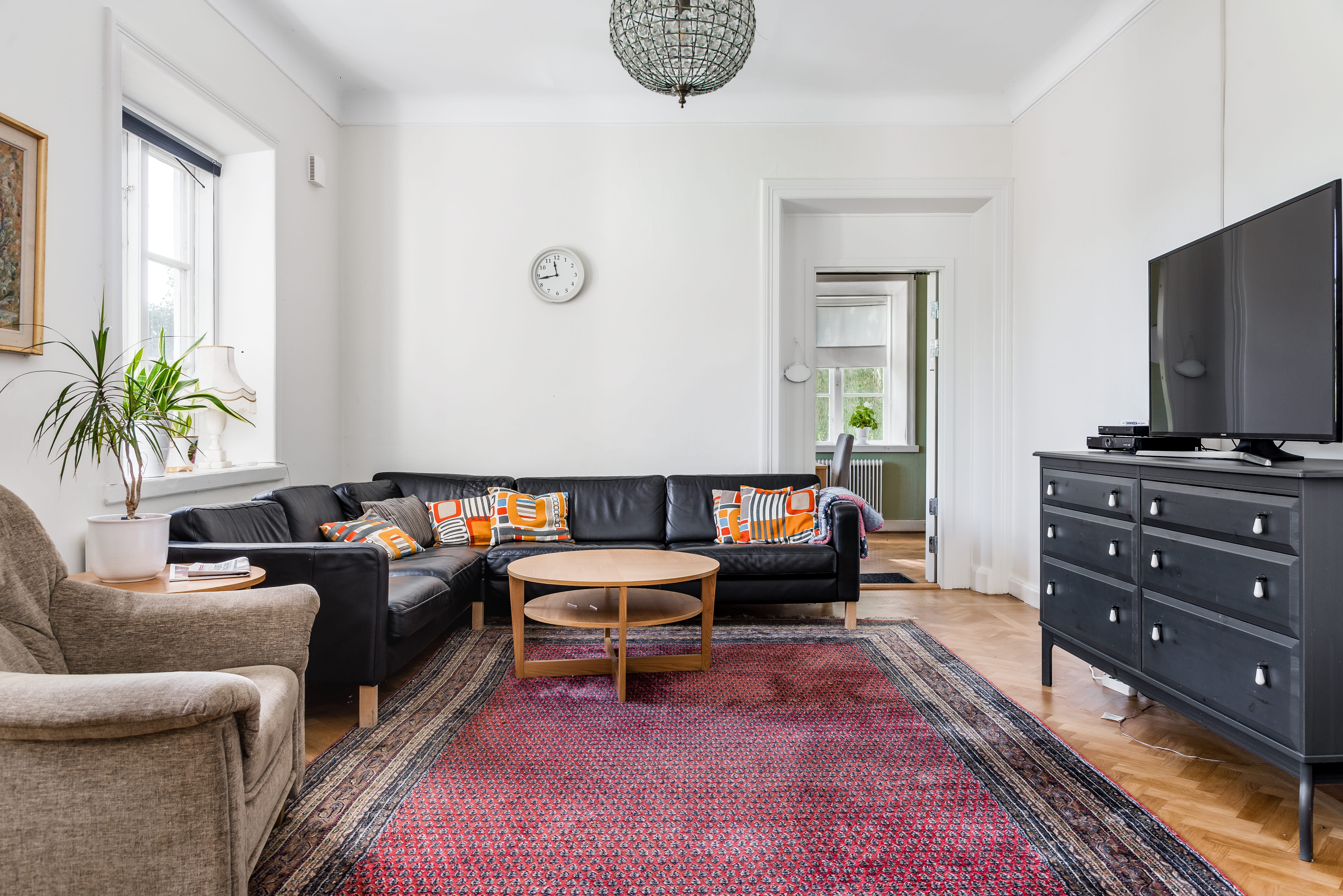 A living room filled with furniture and a flat screen tv