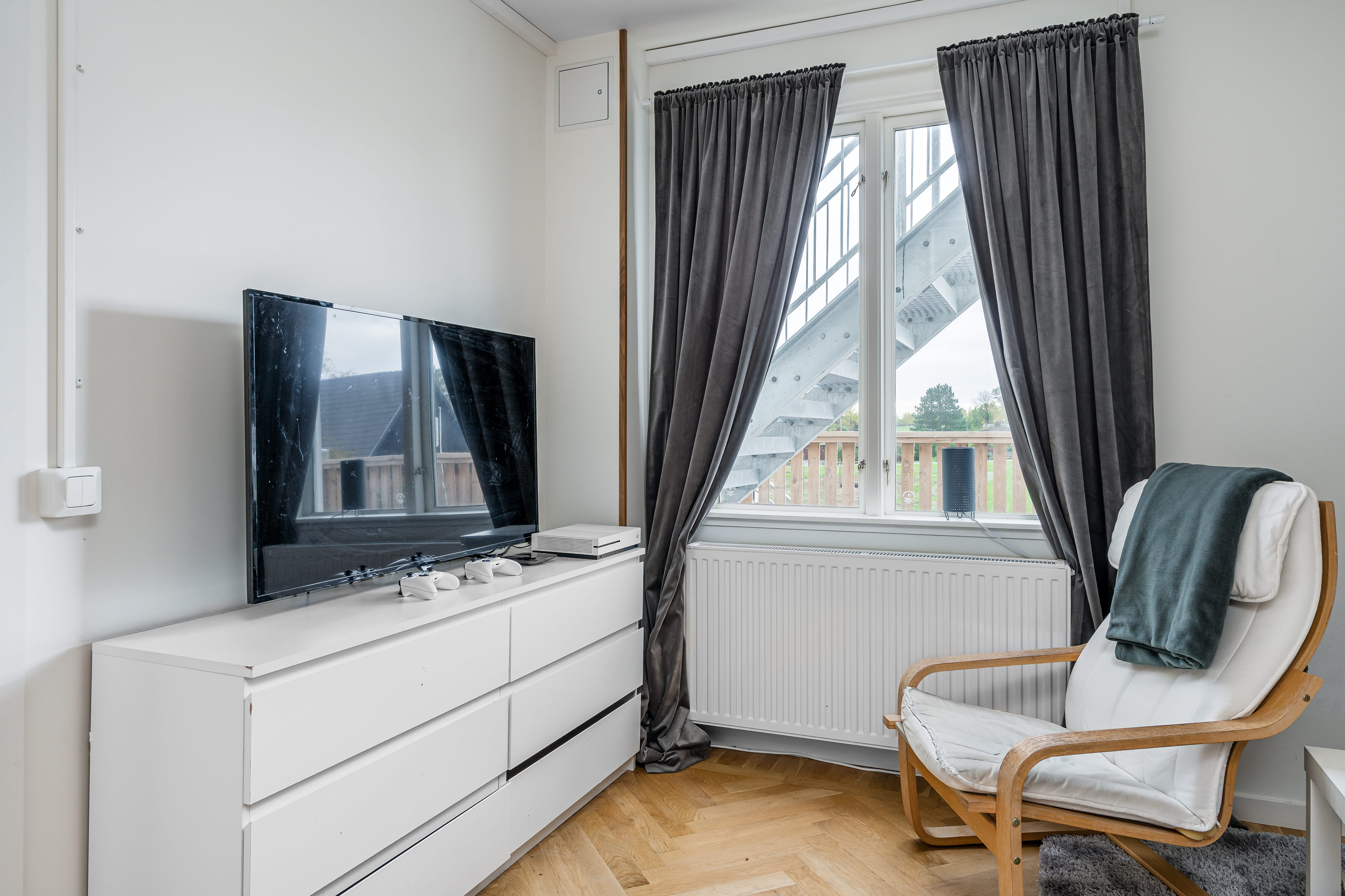 A living room filled with furniture and a large window