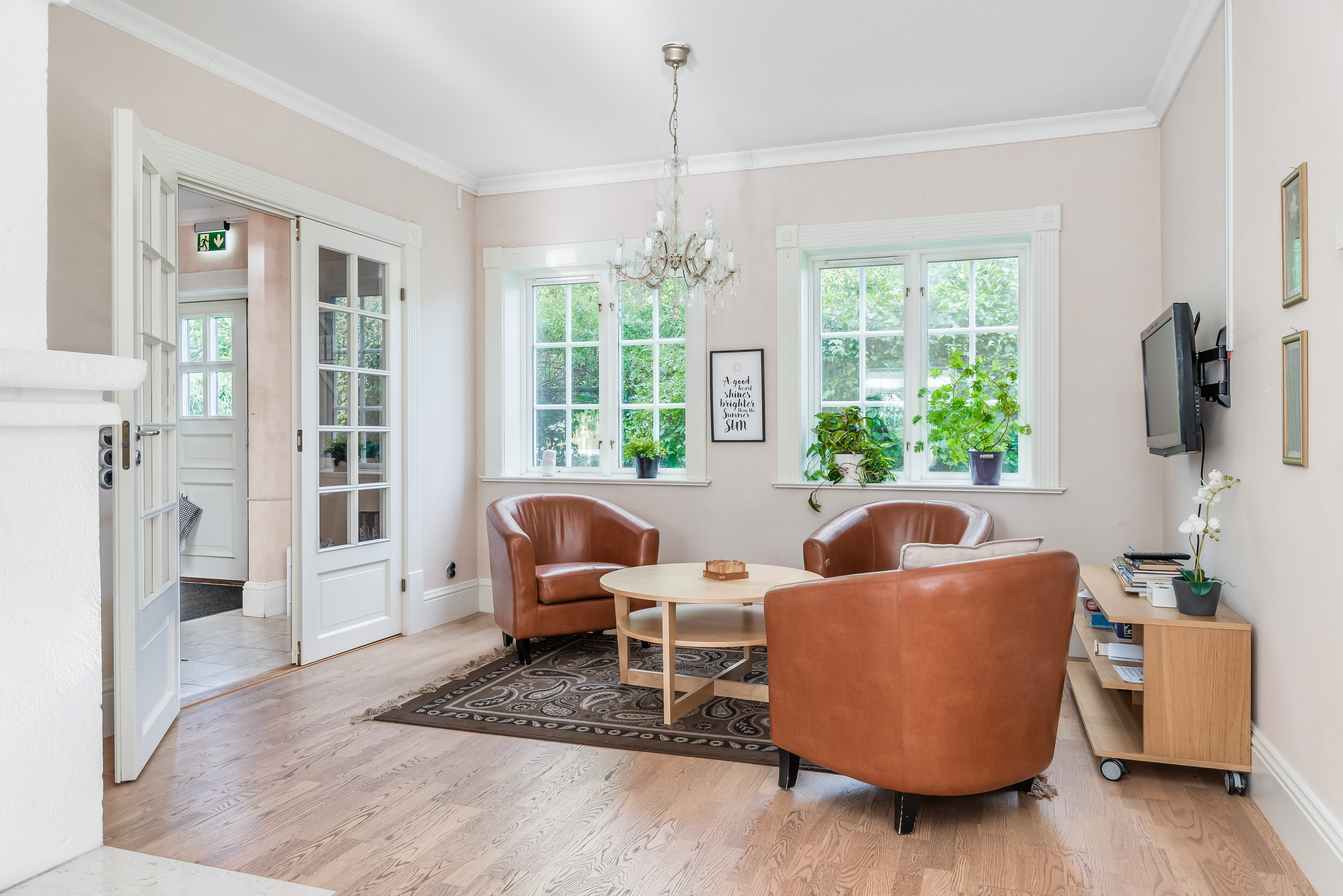 A living room filled with furniture and a large window
