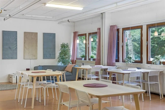 A dining room table in front of a window