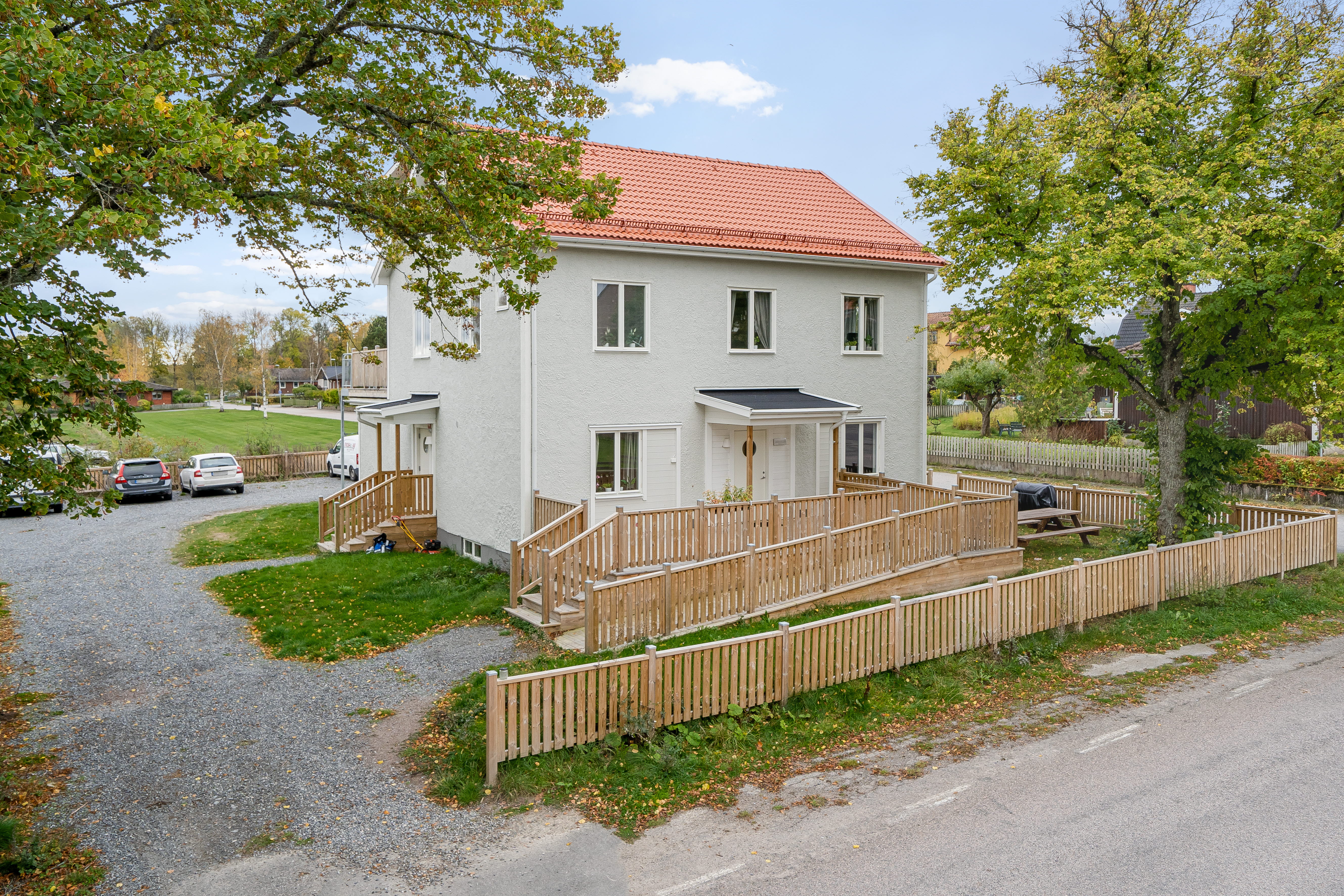 A path with grass in front of a house