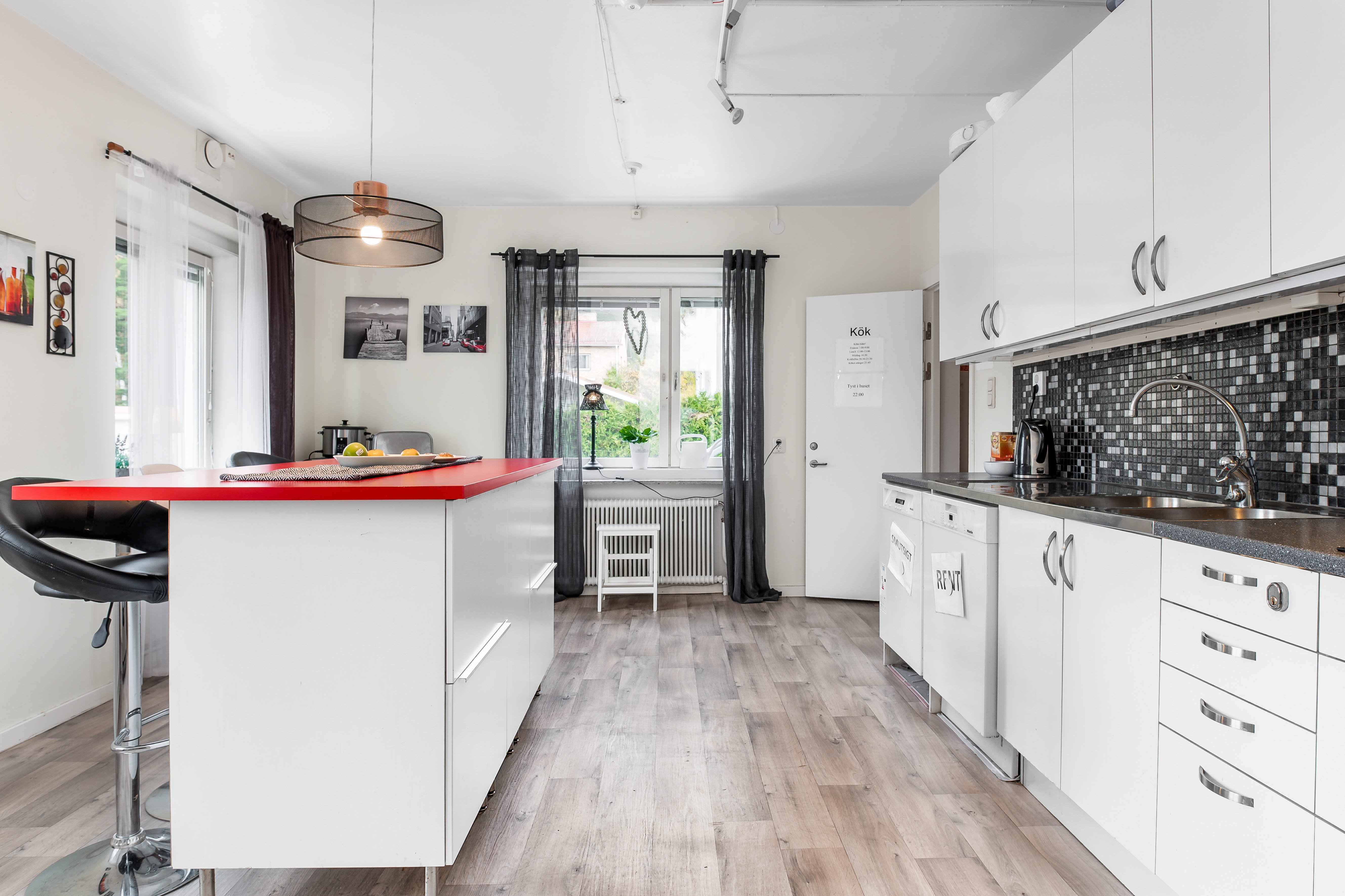 A large kitchen with stainless steel appliances