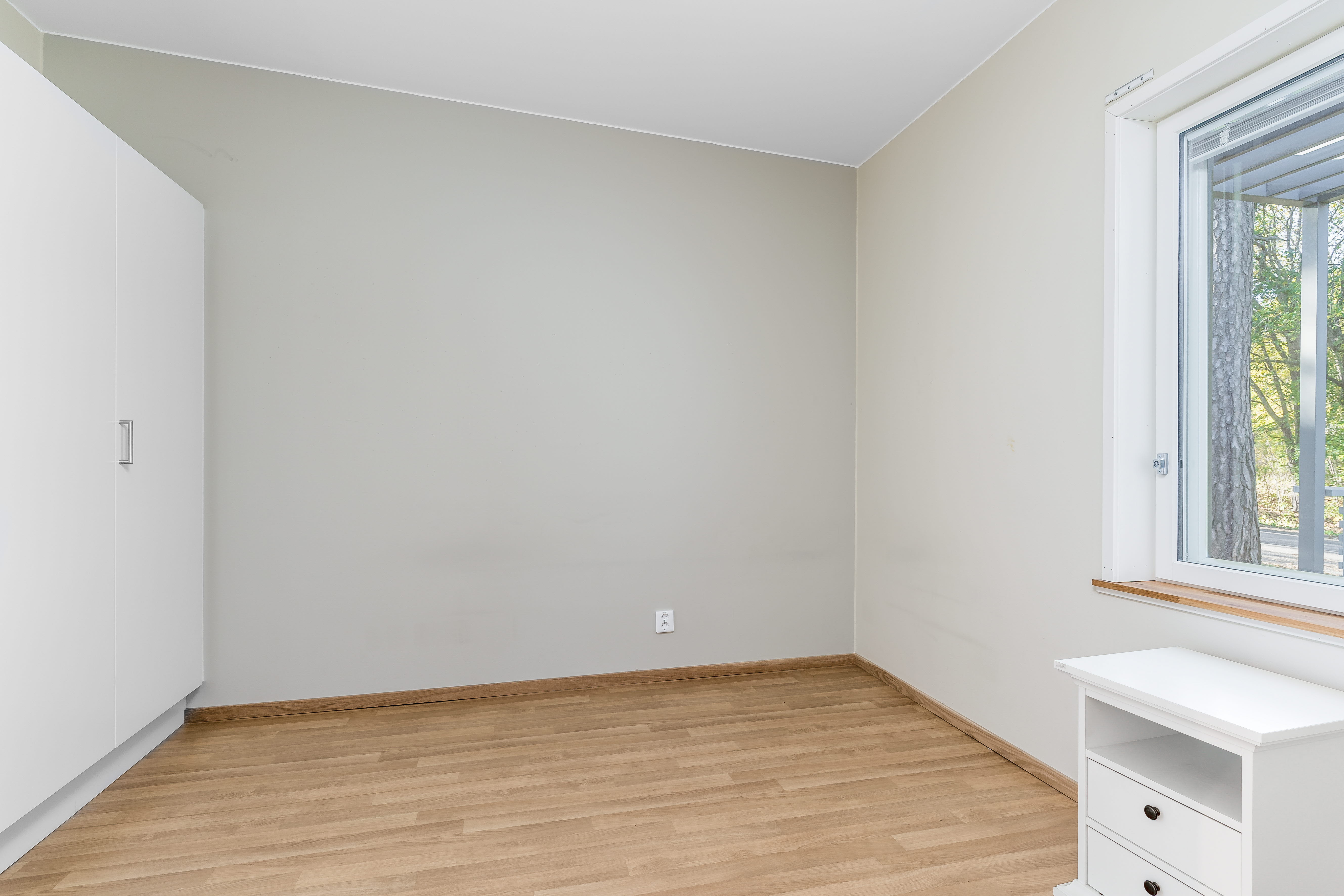 A kitchen with a hard wood floor