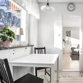 A kitchen with a dining table