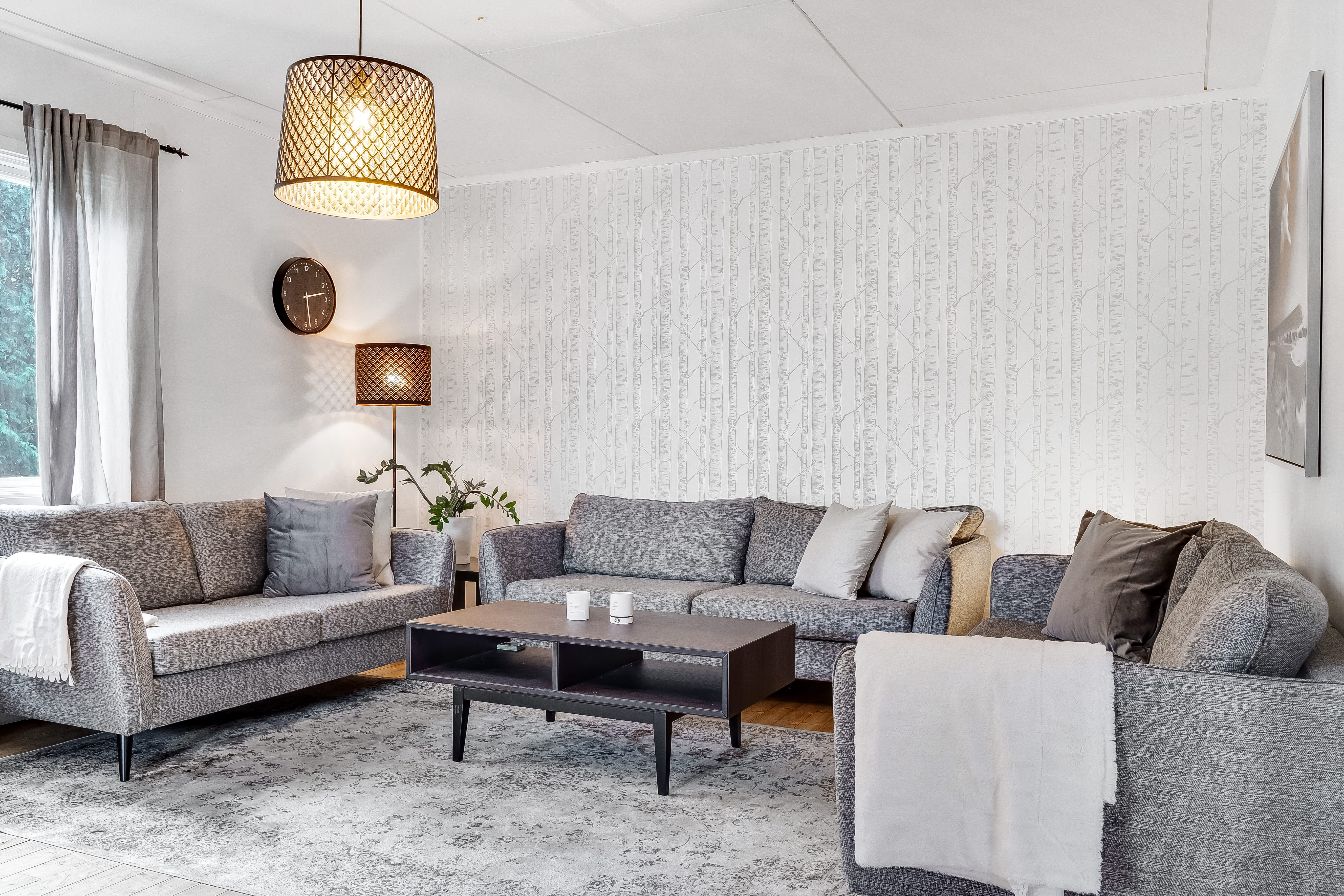A living room filled with furniture and a fireplace