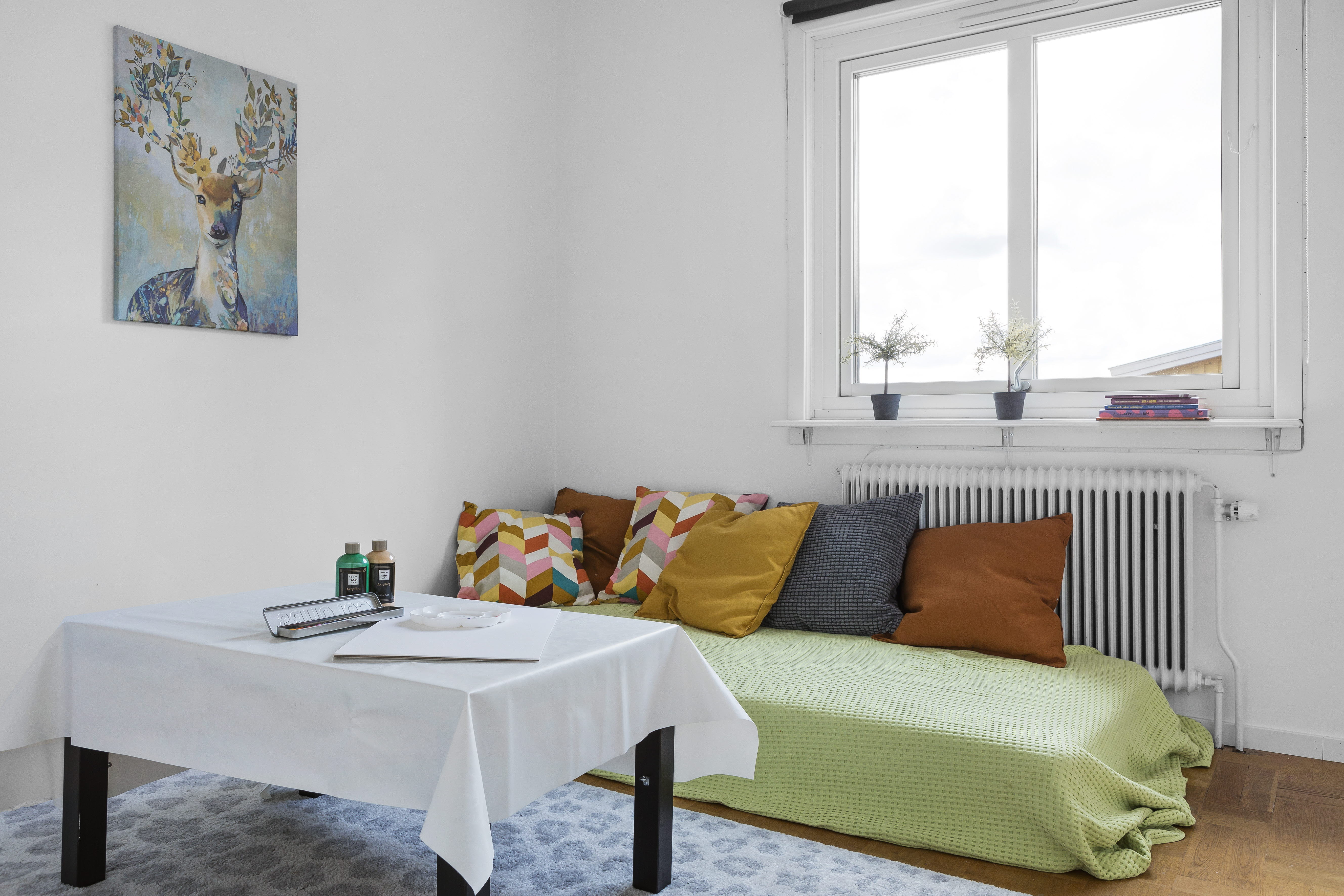 A living room filled with furniture and a large window