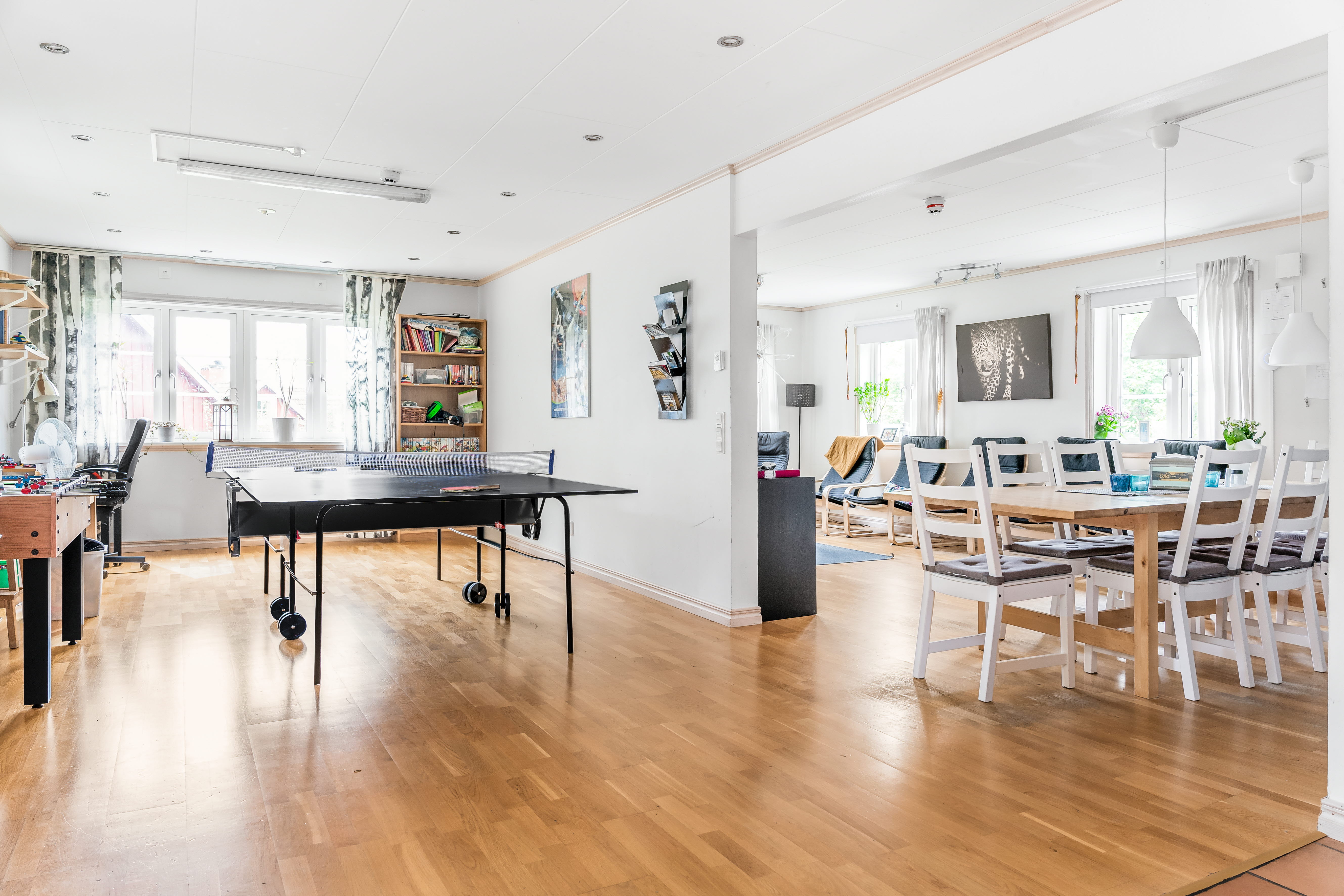A room filled with furniture on top of a hard wood floor