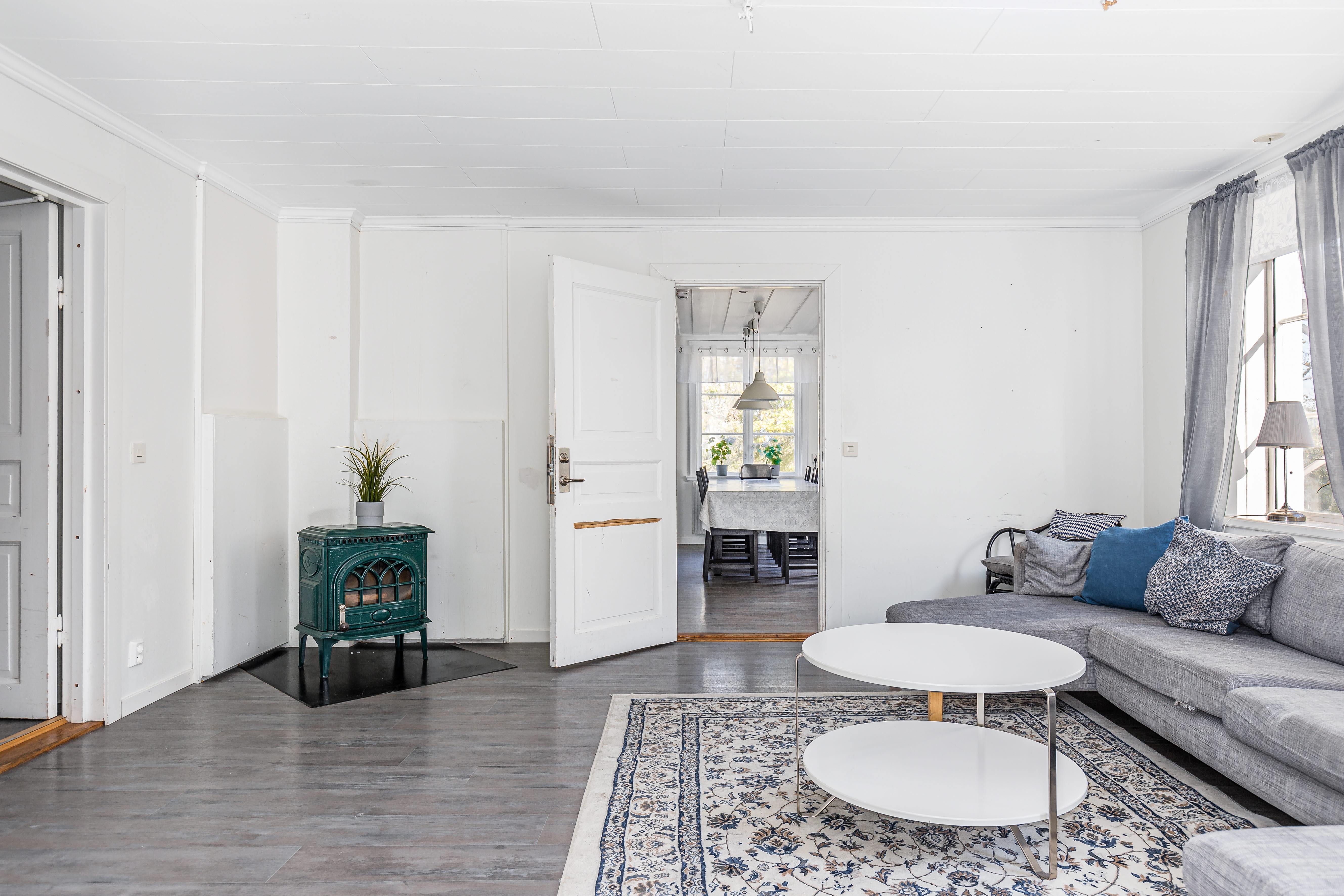 A living room filled with furniture and a flat screen tv