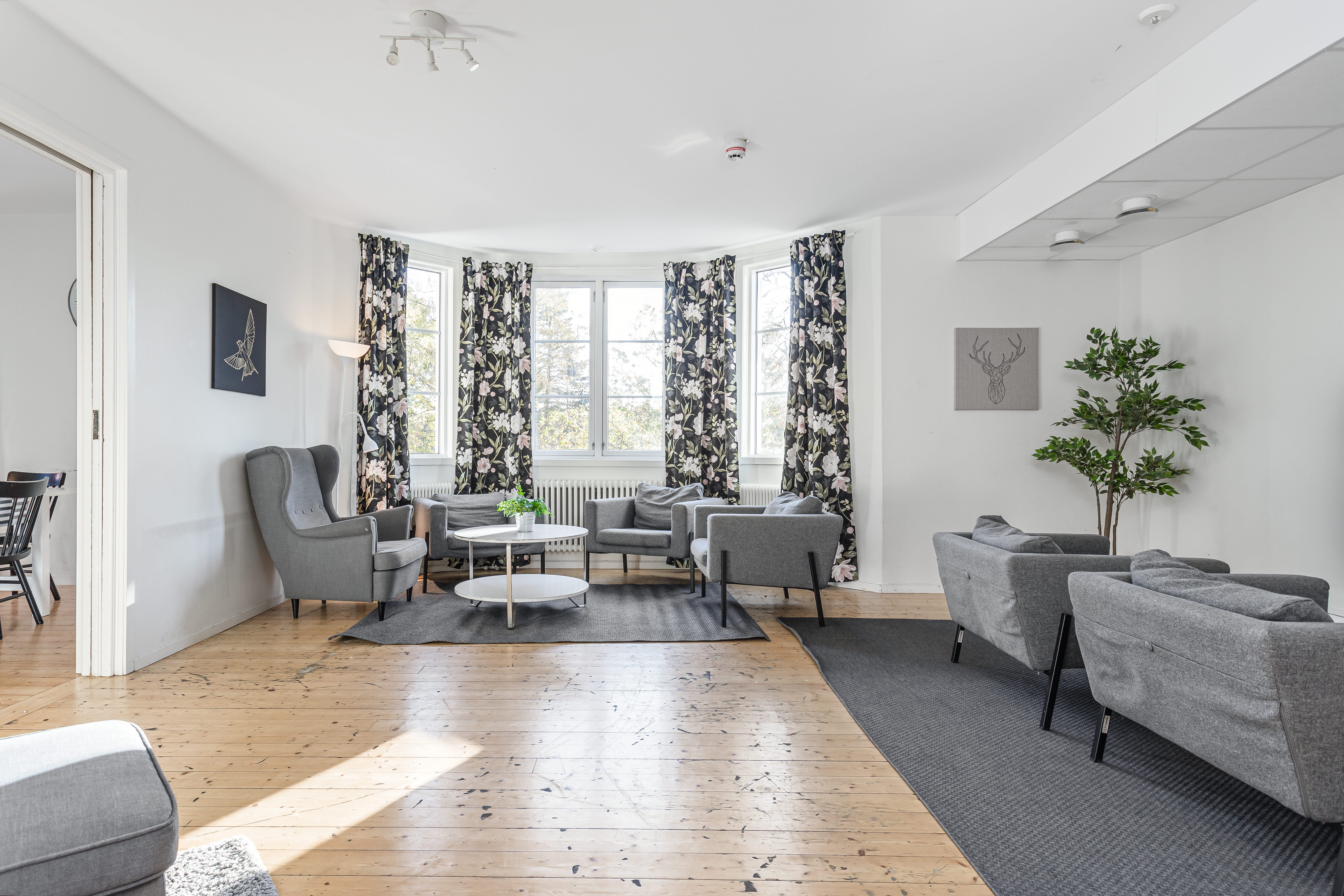 A living room filled with furniture and a large window