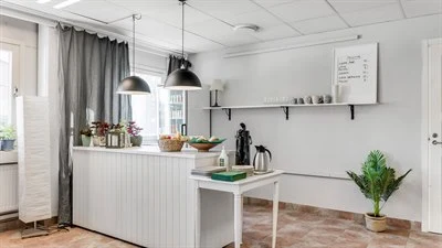 A kitchen with a table in a room