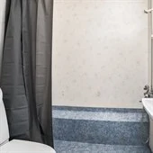 A shower that has a sink and a mirror