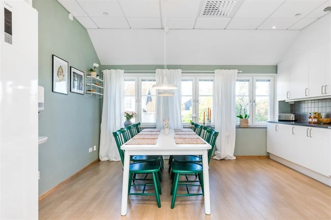 A kitchen with a hard wood floor