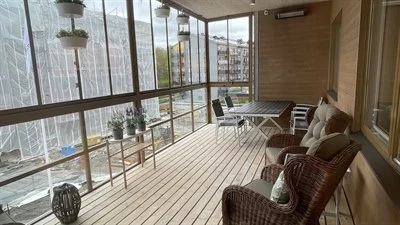 A balcony with armchairs
