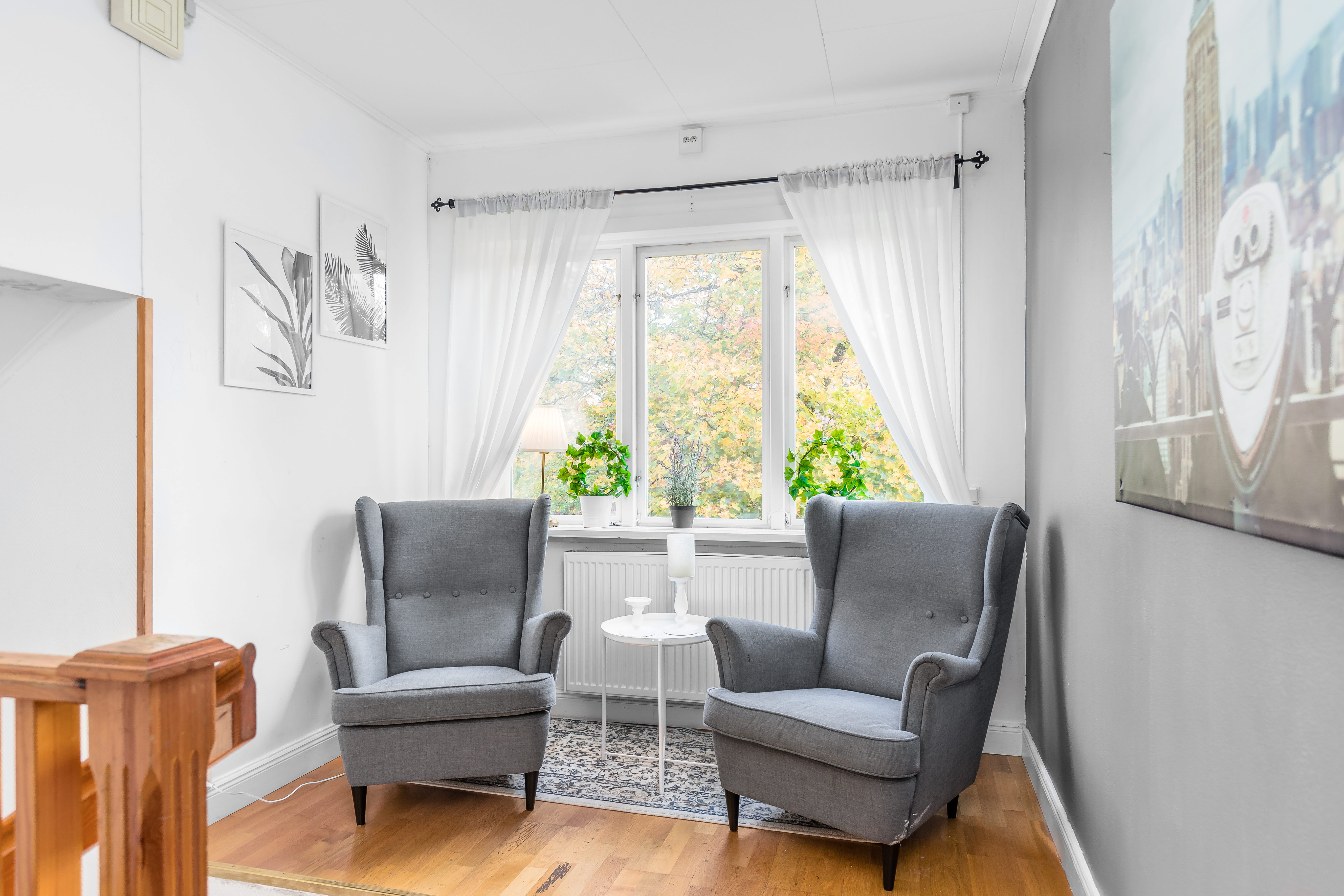 A living room filled with furniture and a large window