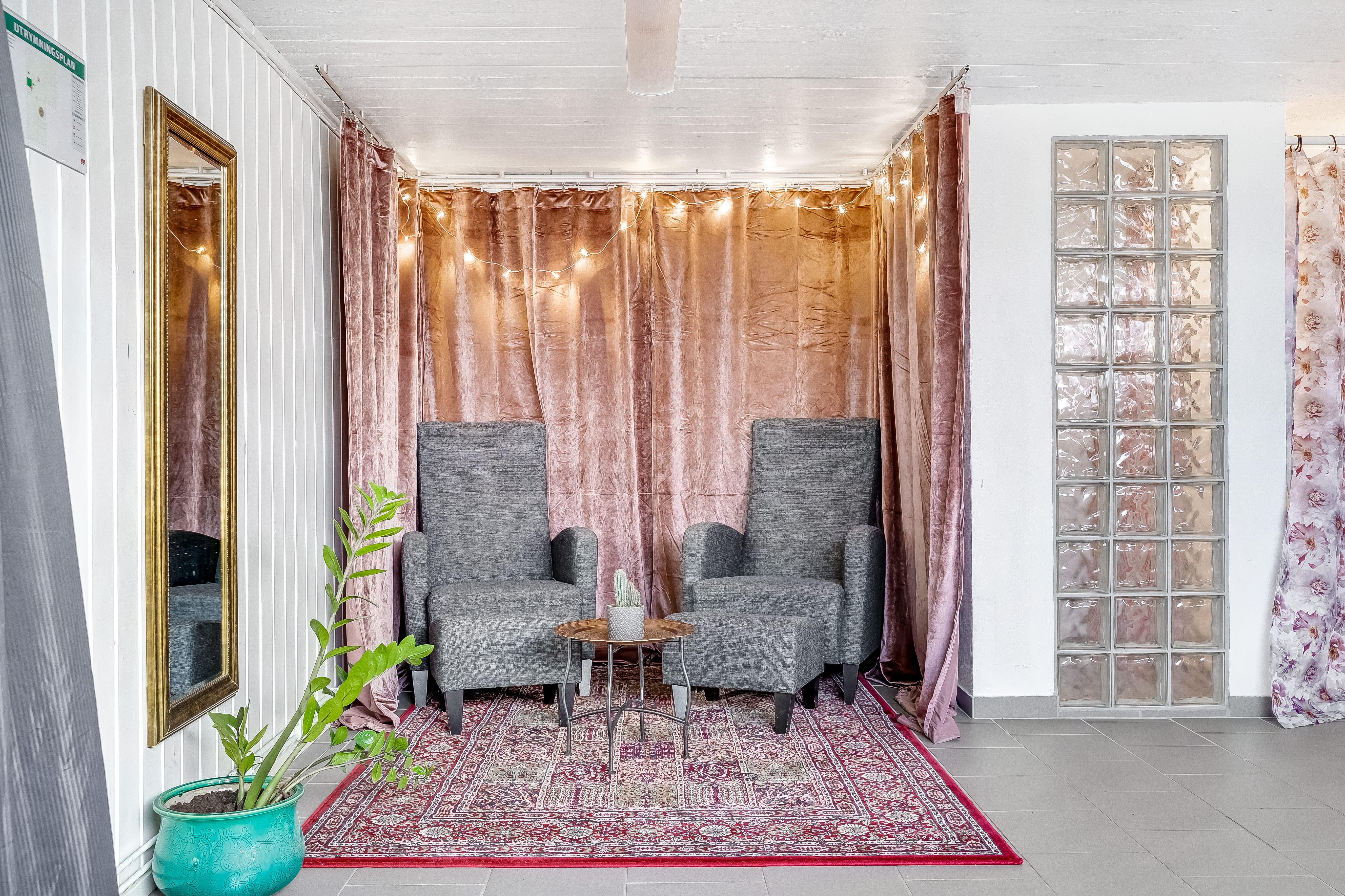 A living room filled with furniture and a large window