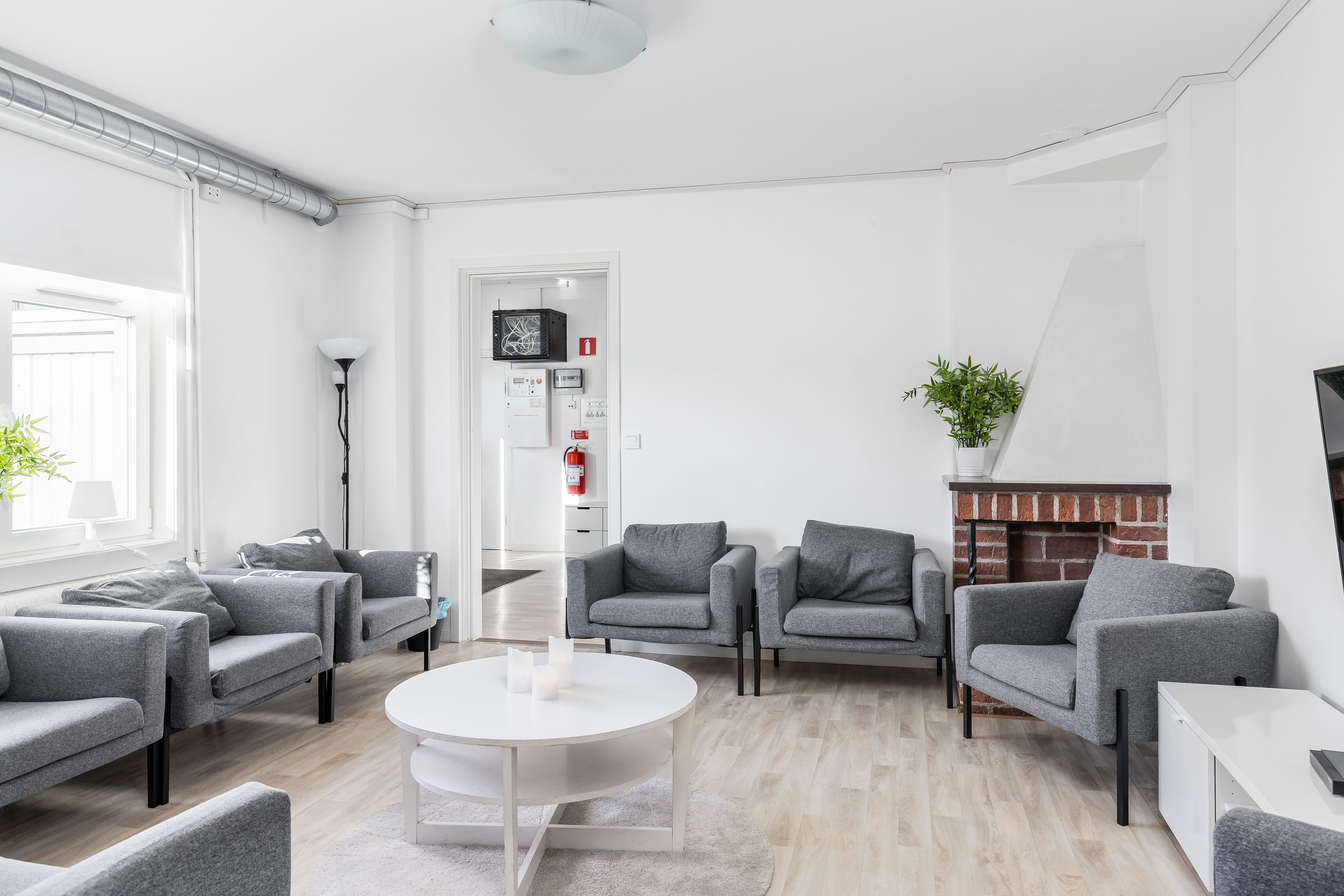 A living room filled with furniture and a large window