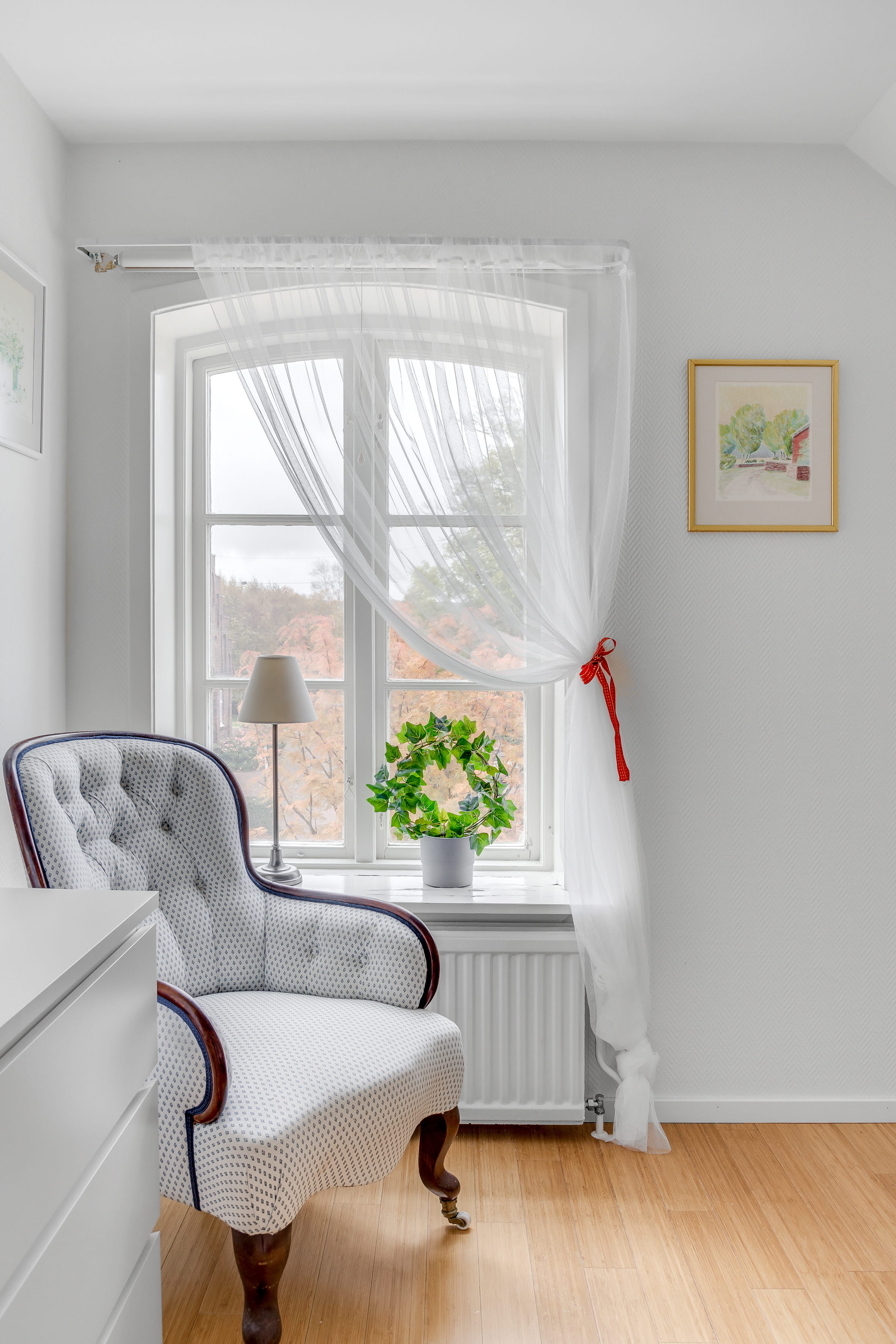 A living room filled with furniture and a large window