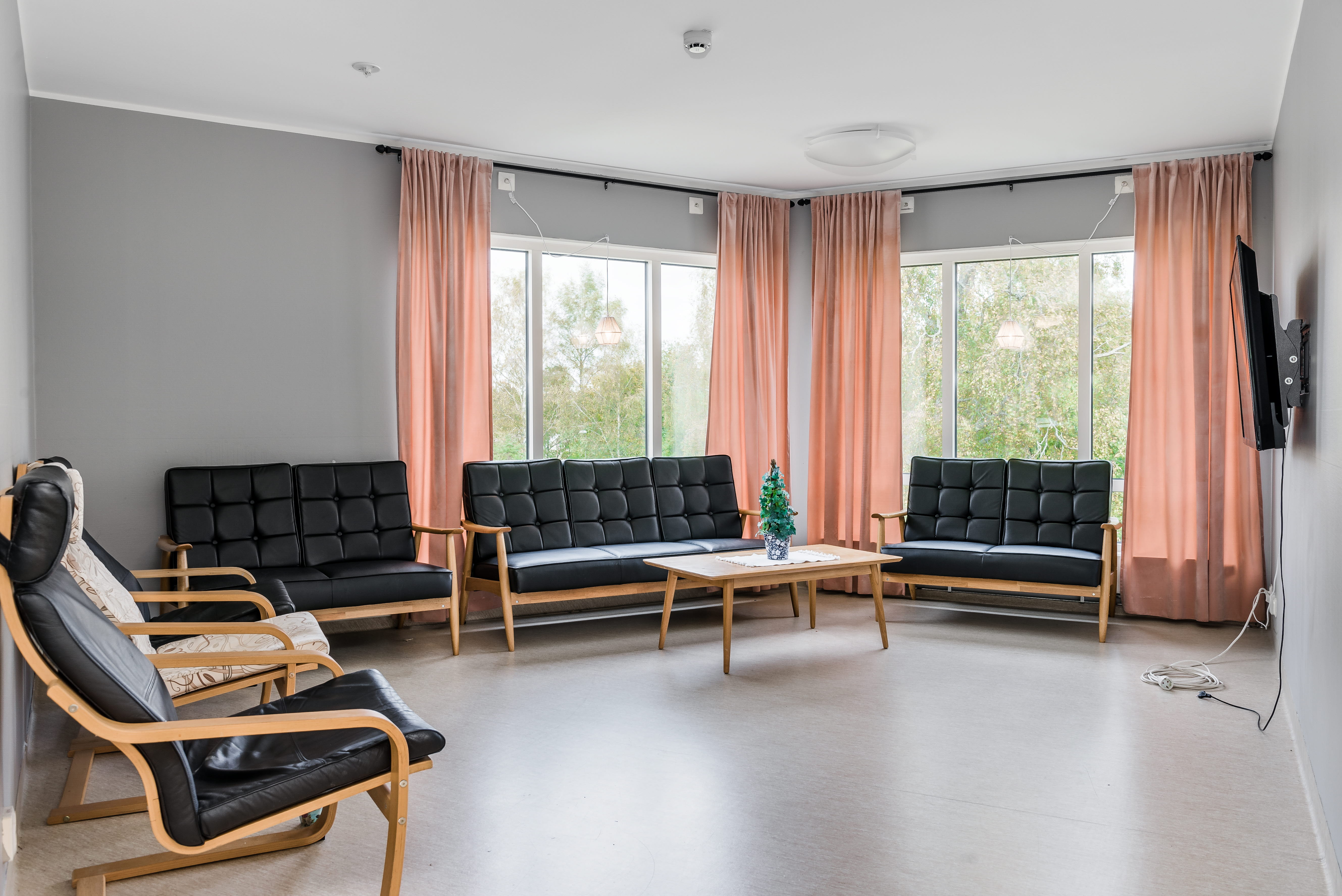A living room filled with furniture and a large window
