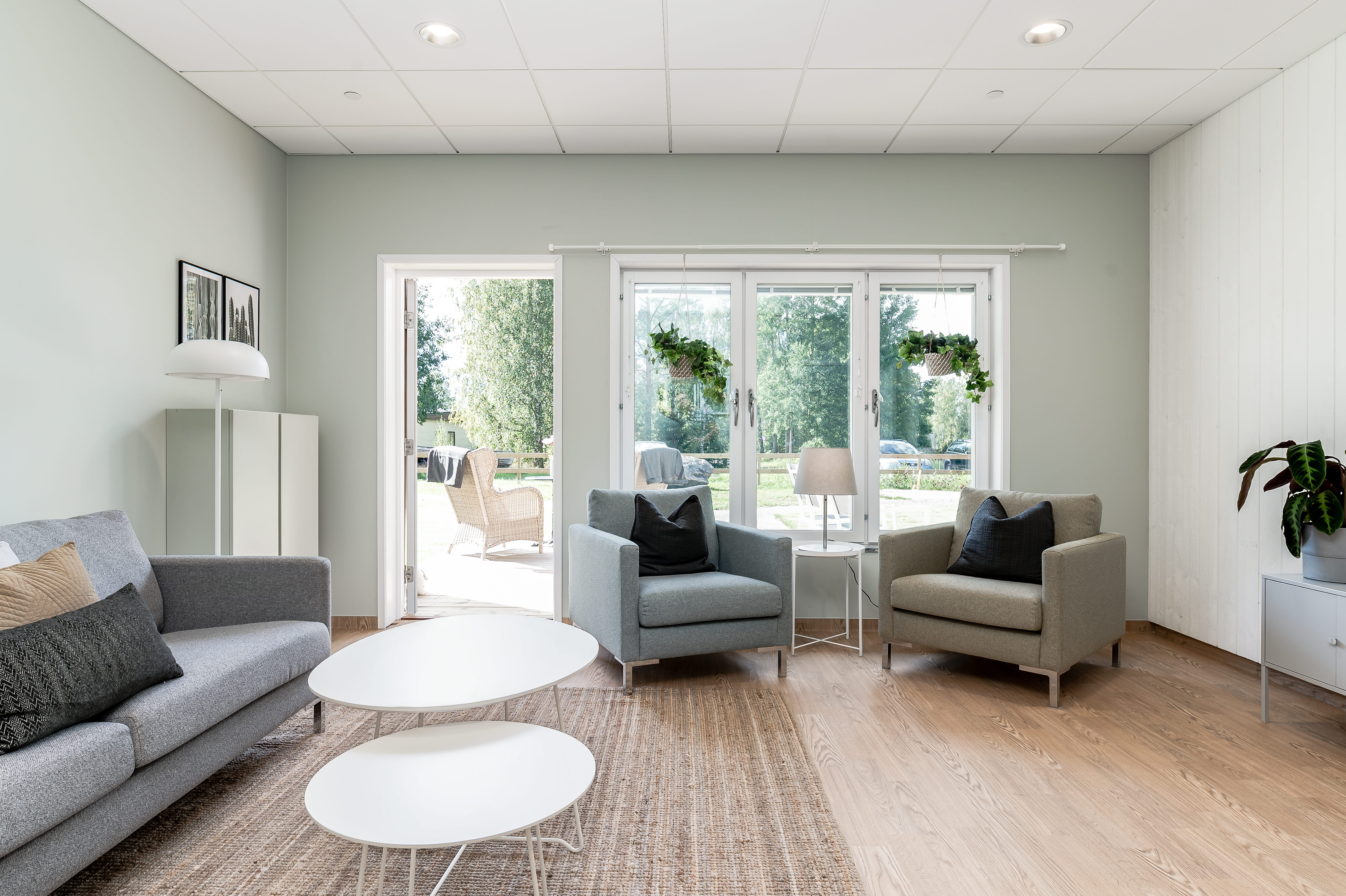 A living room filled with furniture and a large window