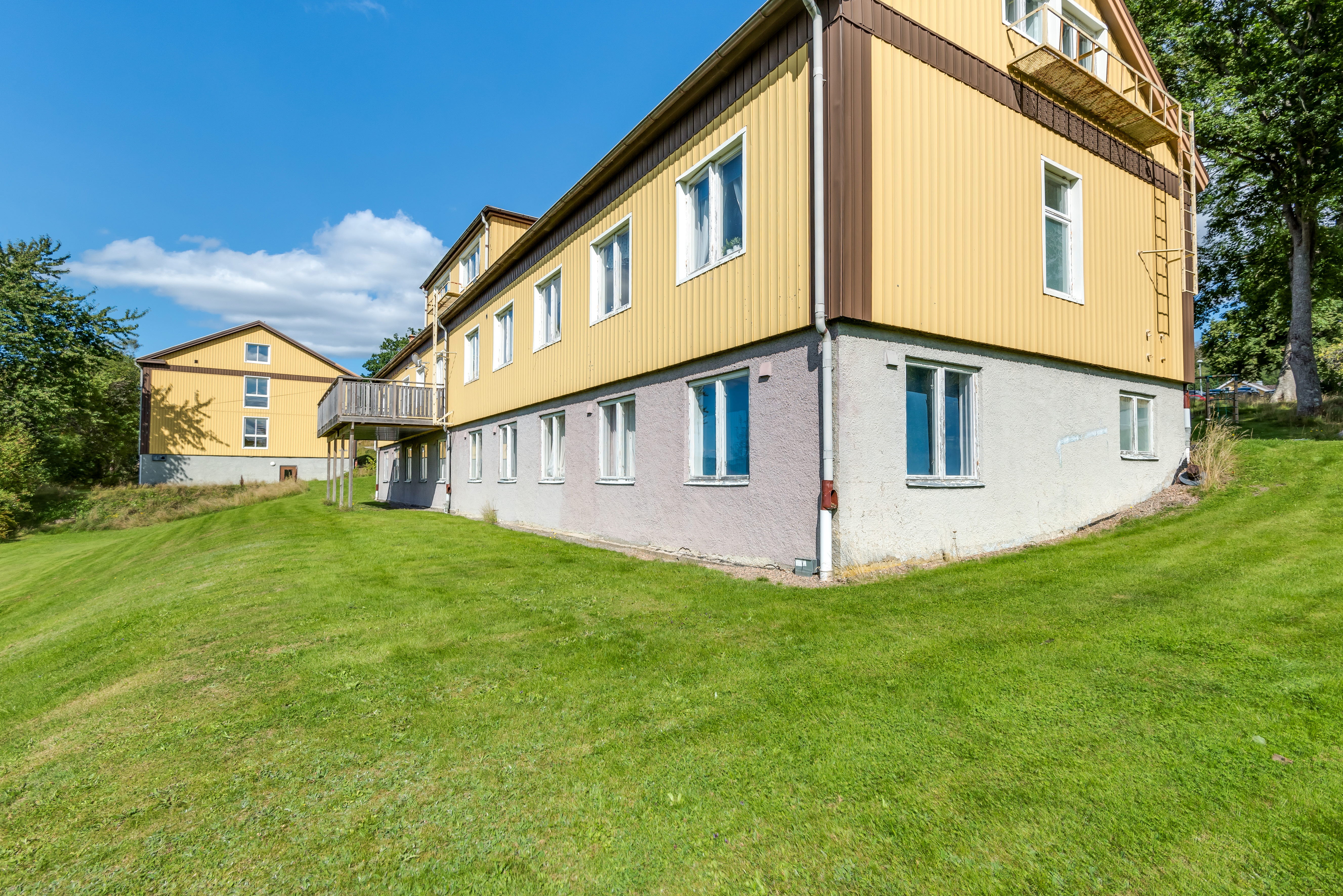 A building with a grassy field
