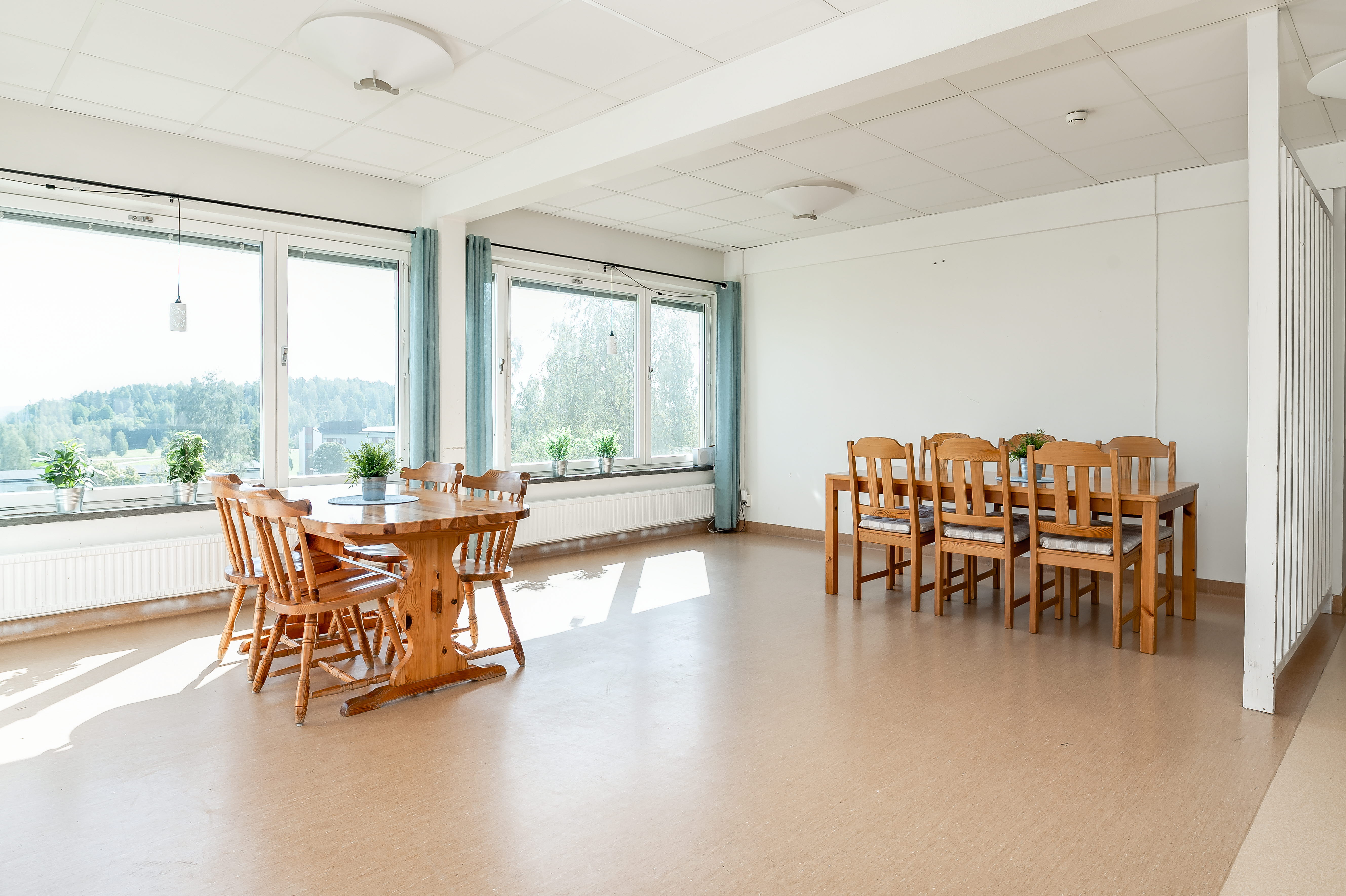 A living room filled with furniture and a large window