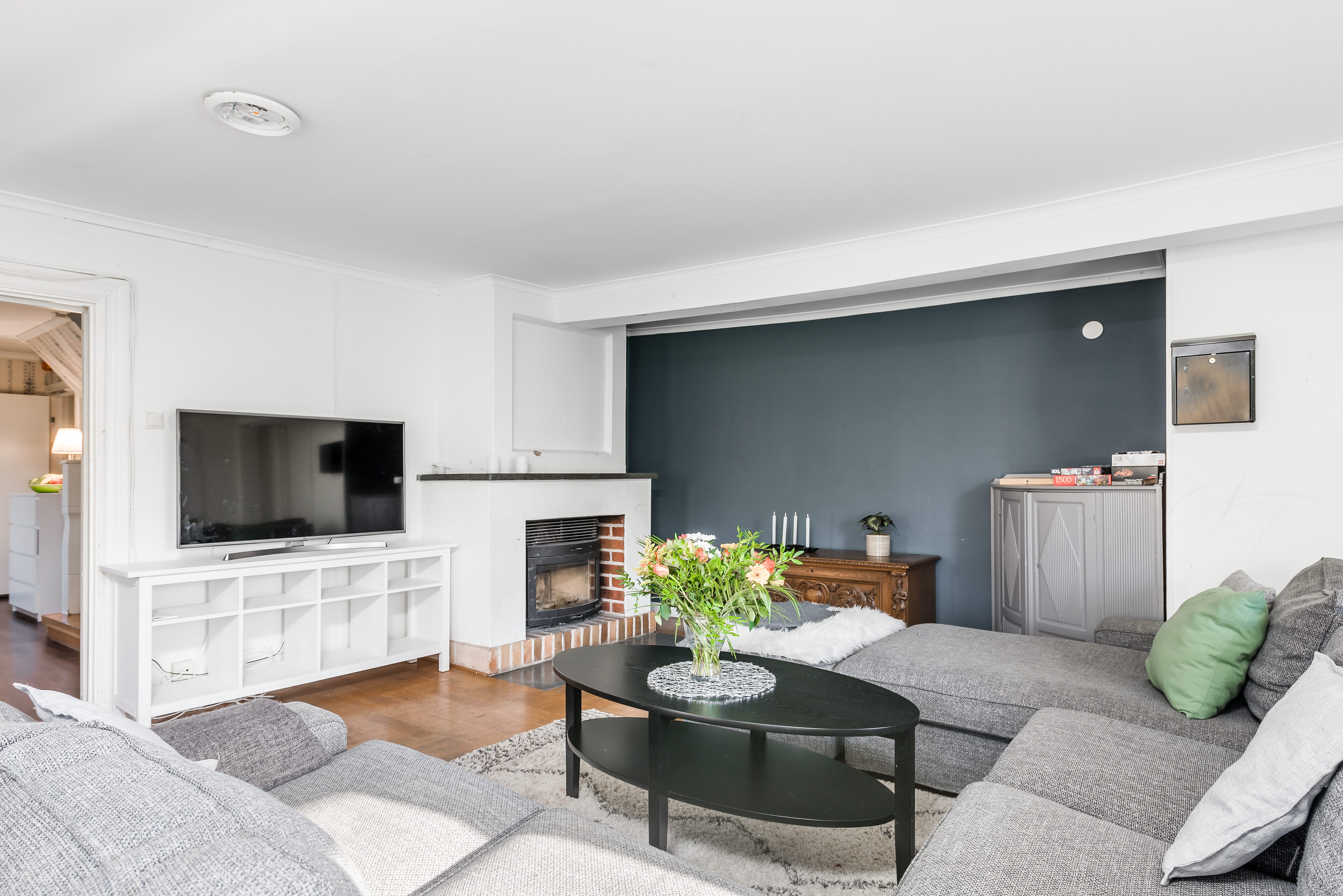 A living room filled with furniture and a large window