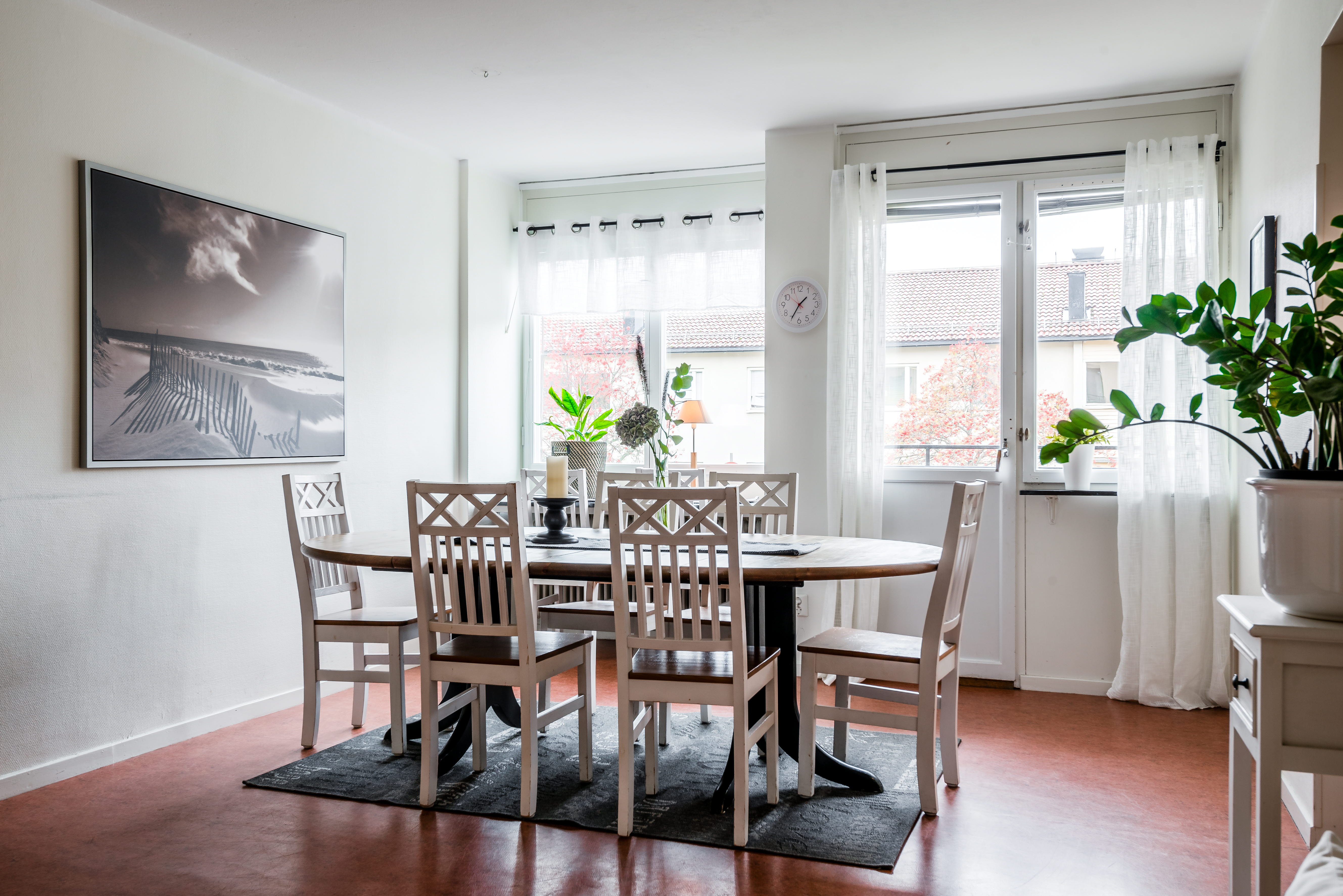A dining room table in front of a window