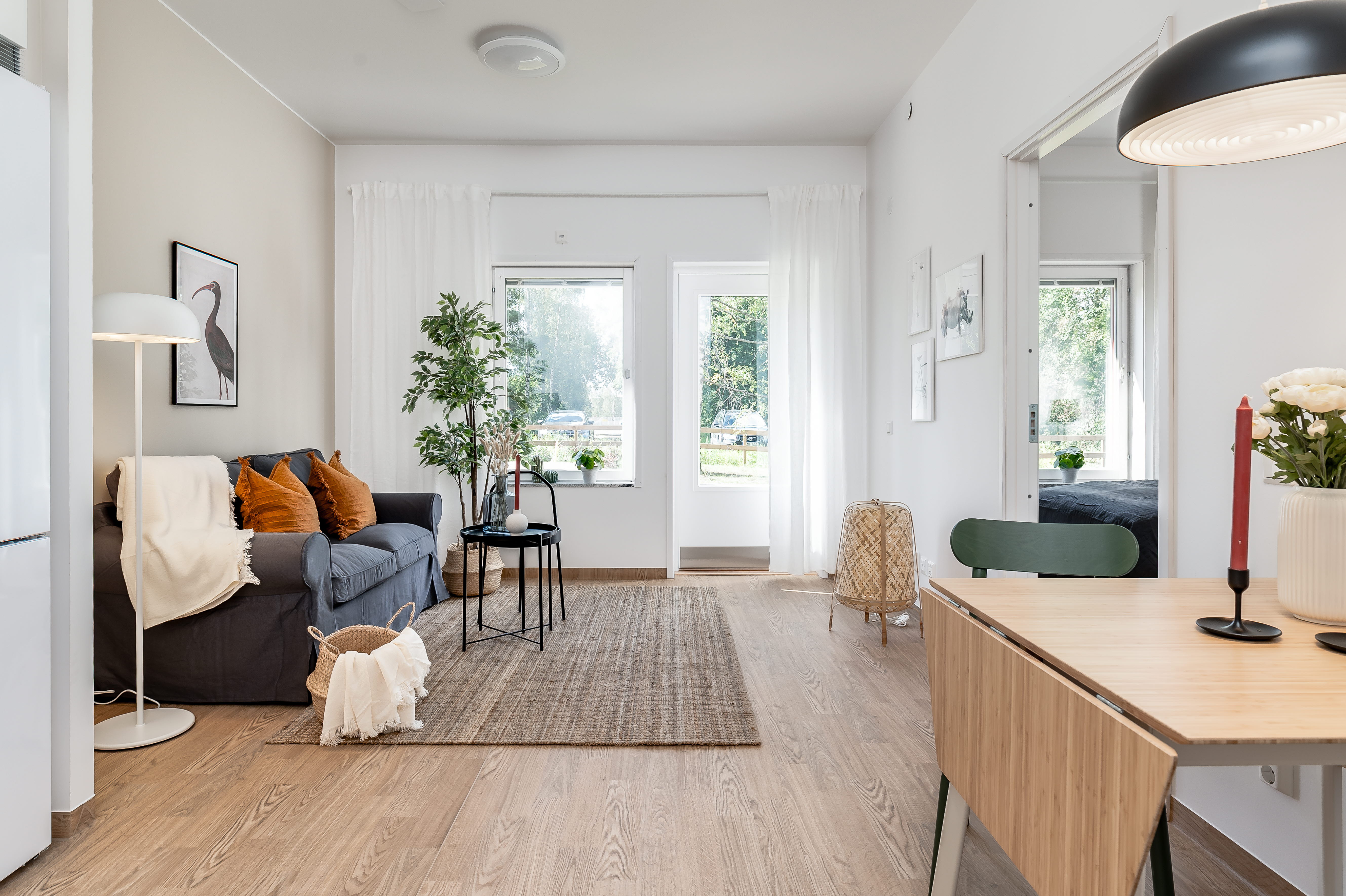 A living room filled with furniture and a large window
