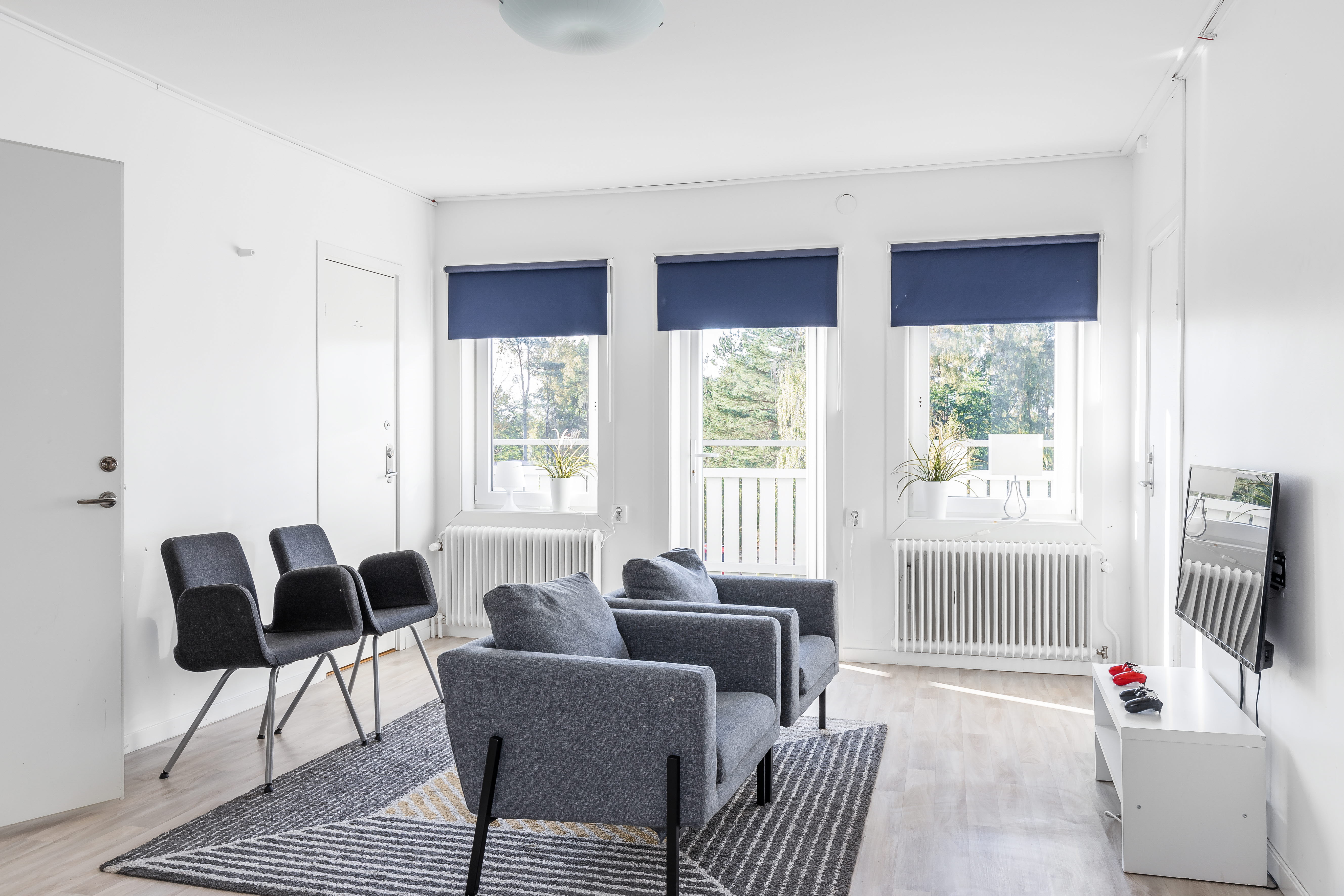 A living room filled with furniture and a large window