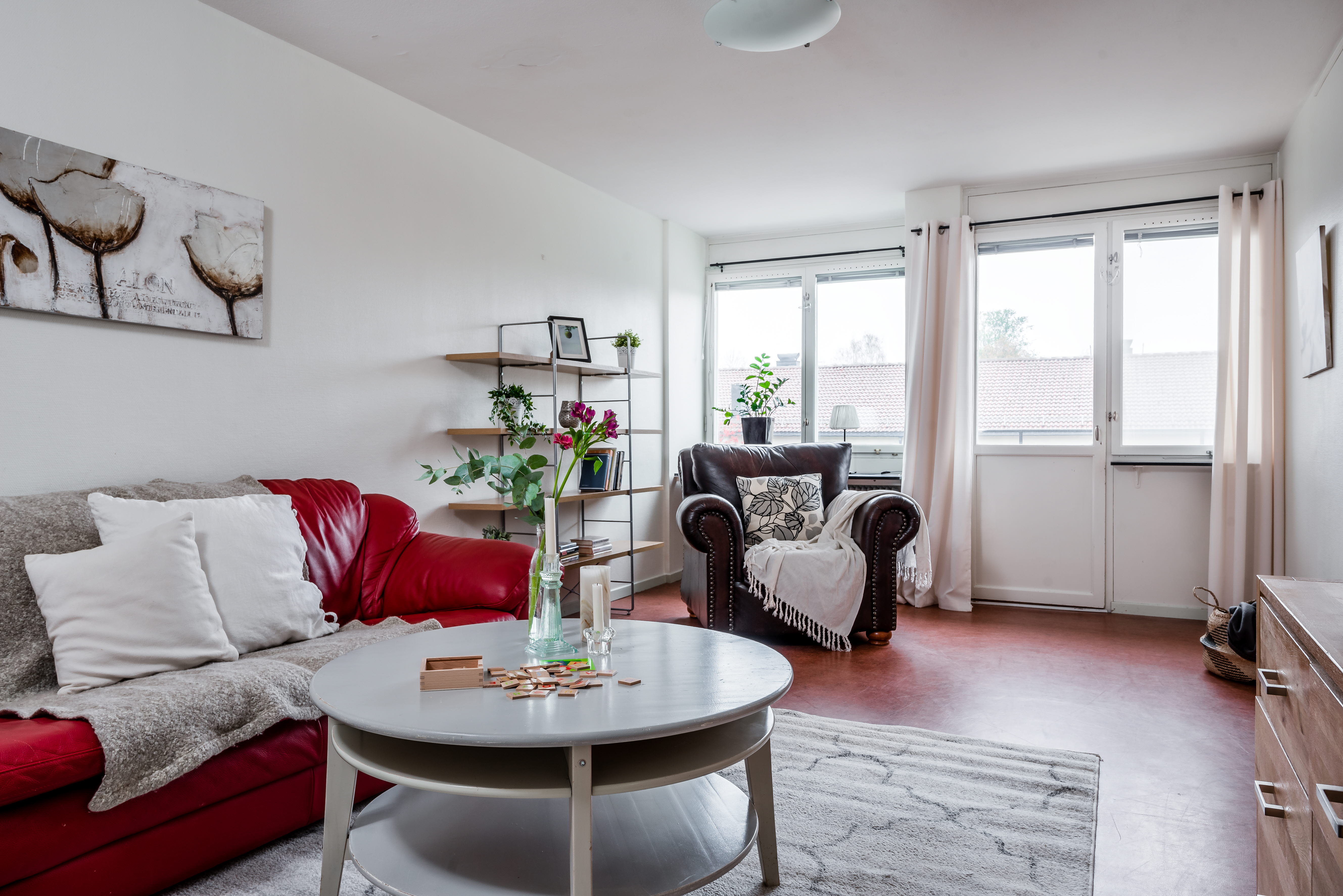 A living room filled with furniture and a large window