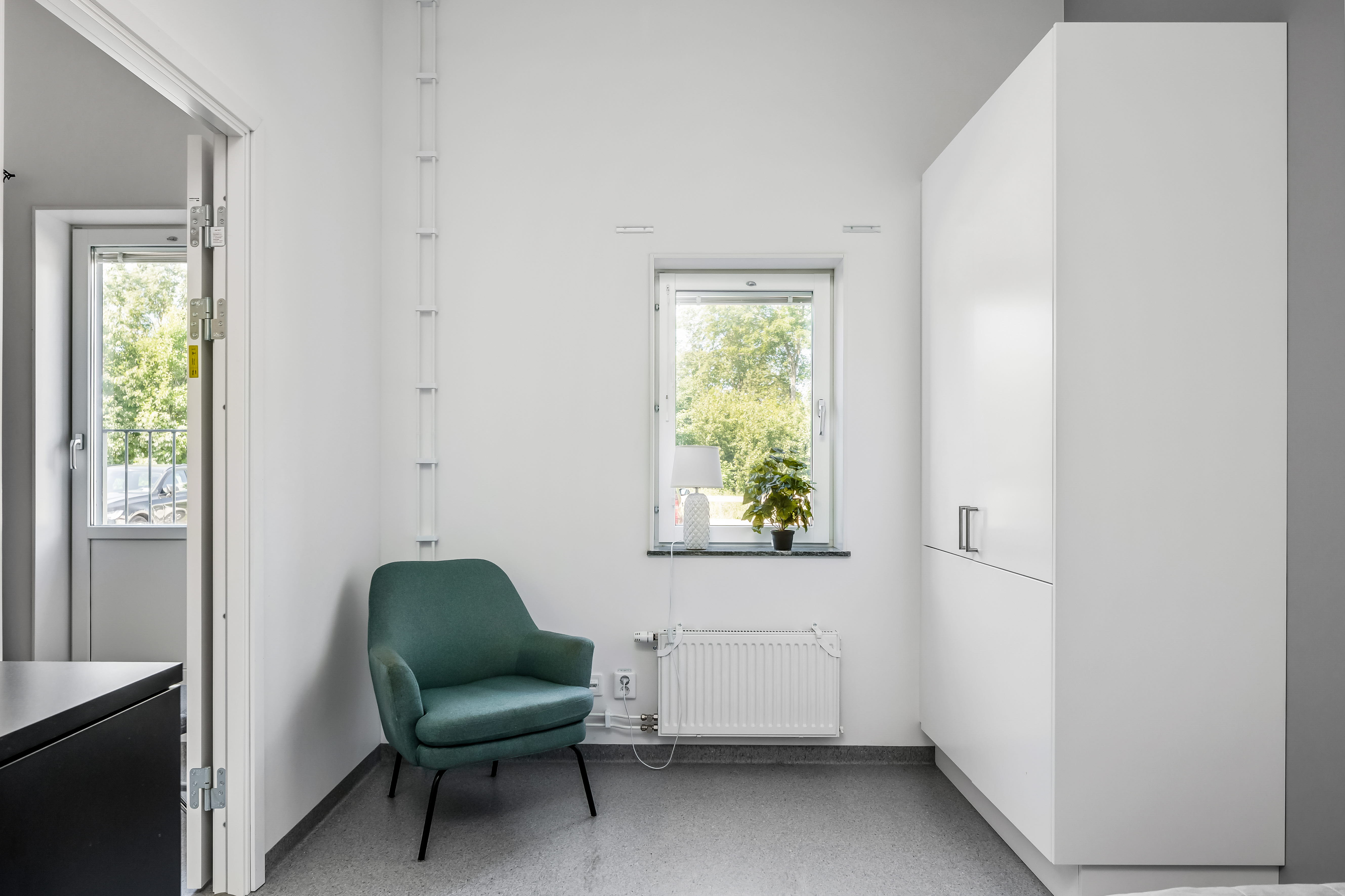 A room filled with furniture and a large window